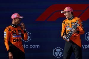 May 4, 2025; Miami Gardens, FL, USA; McLaren driver Oscar Piastri (right) celebrates with the winners trophy while talking McLaren driver Lando Norris (left) after winning the F1 Miami Grand Prix at Miami International Autodrome.
