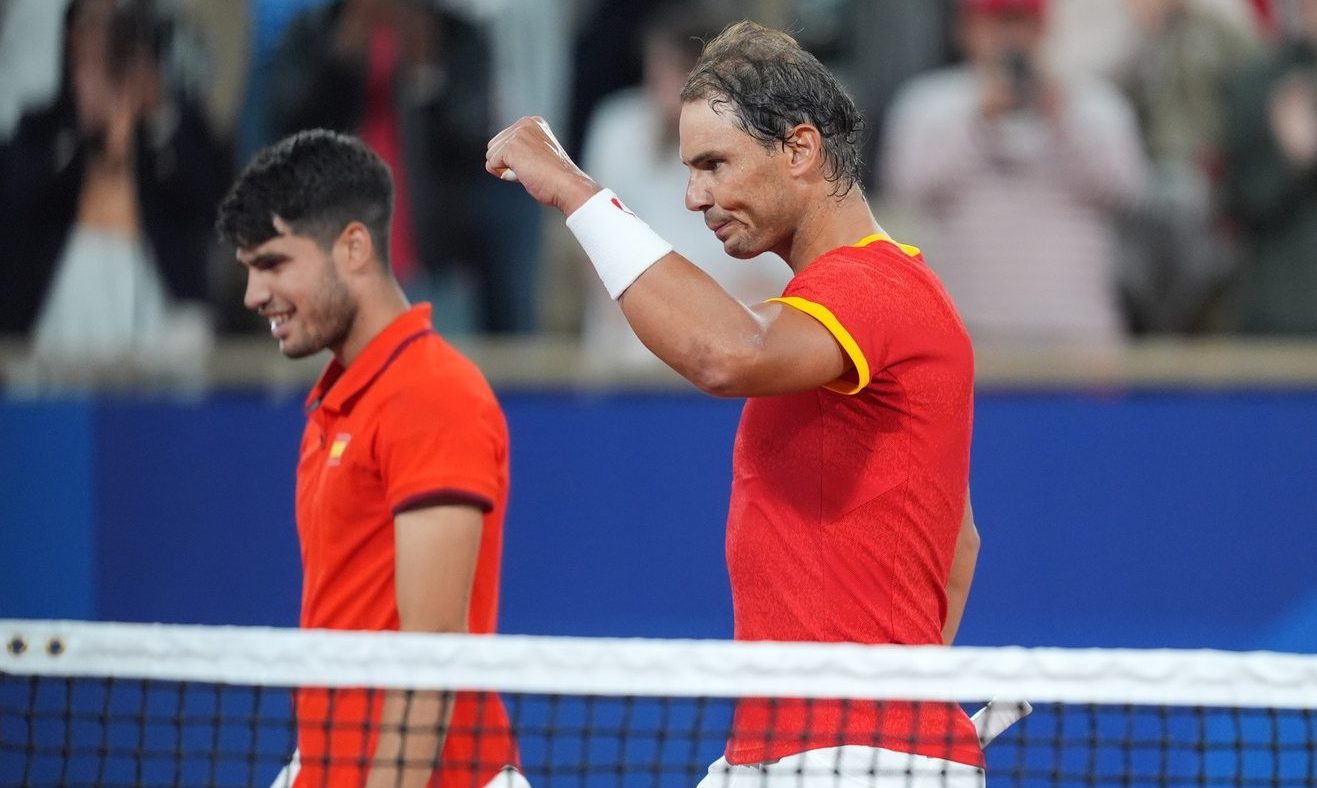 Jul 27, 2024; Paris, France; Rafael Nadal (ESP) and Carlos Alcaraz (ESP) celebrate defeating Maximo Gonzalez (ARG) and Andres Molteni (ARG) in a men's tennis doubles match during the Paris 2024 Olympic Summer Games at Stade Roland Garros.