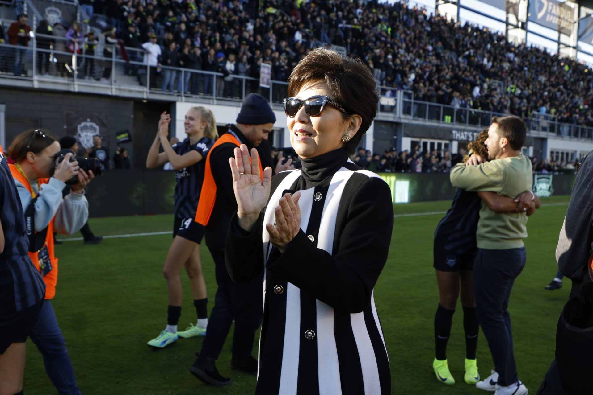 Nov 16, 2024; Washington, District of Columbia, USA; Washington Spirit owner Michele Kang celebrates during a team celebration lap after the playoff semifinal match against NJ/NY Gotham FC at Audi Field.