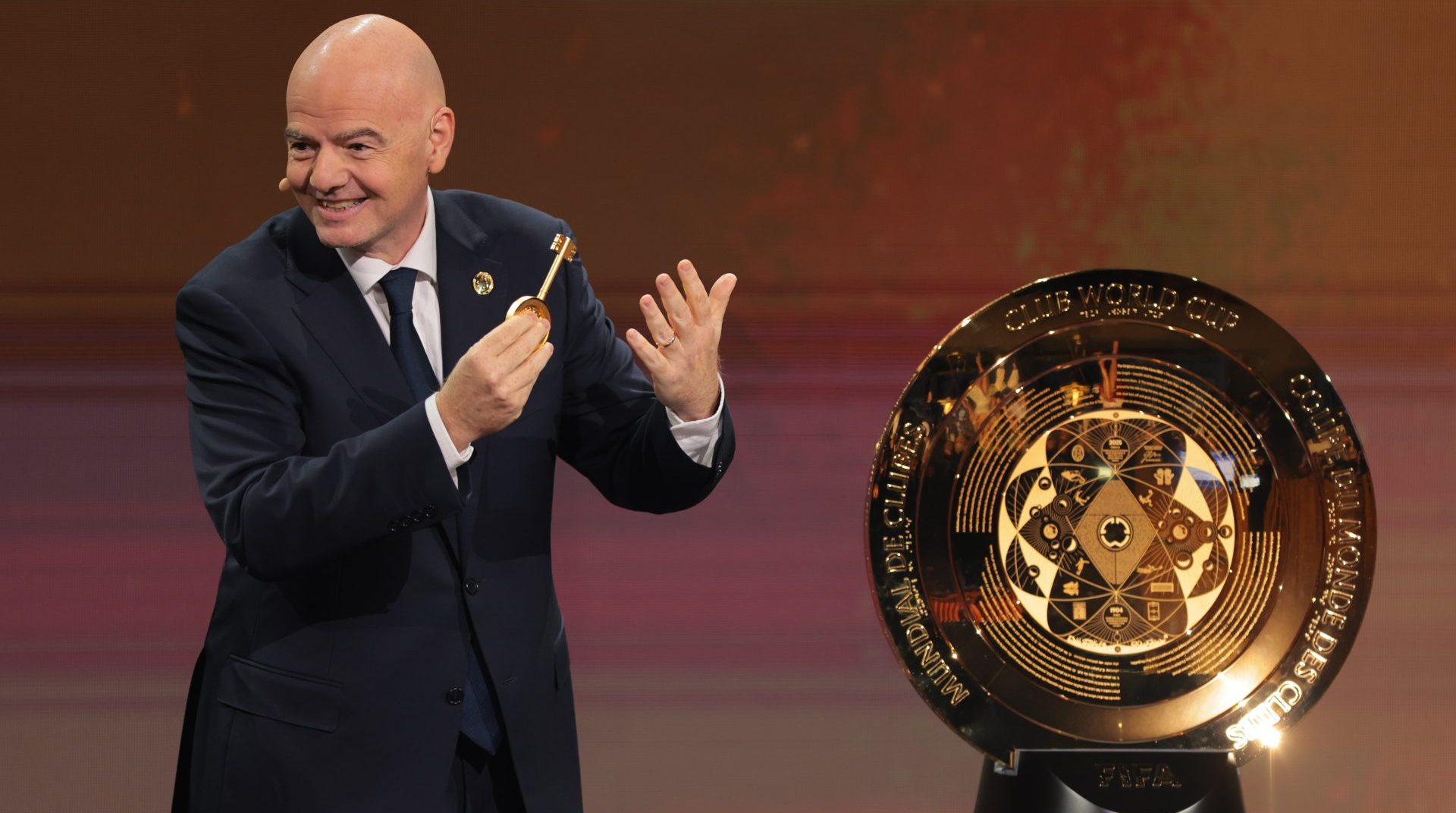 Dec 5, 2024; Miami, FL, USA; FIFA president Gianni Infantino presents the FIFA Club World Cup trophy during the Club Word Cup draw at Telemundo Studios.