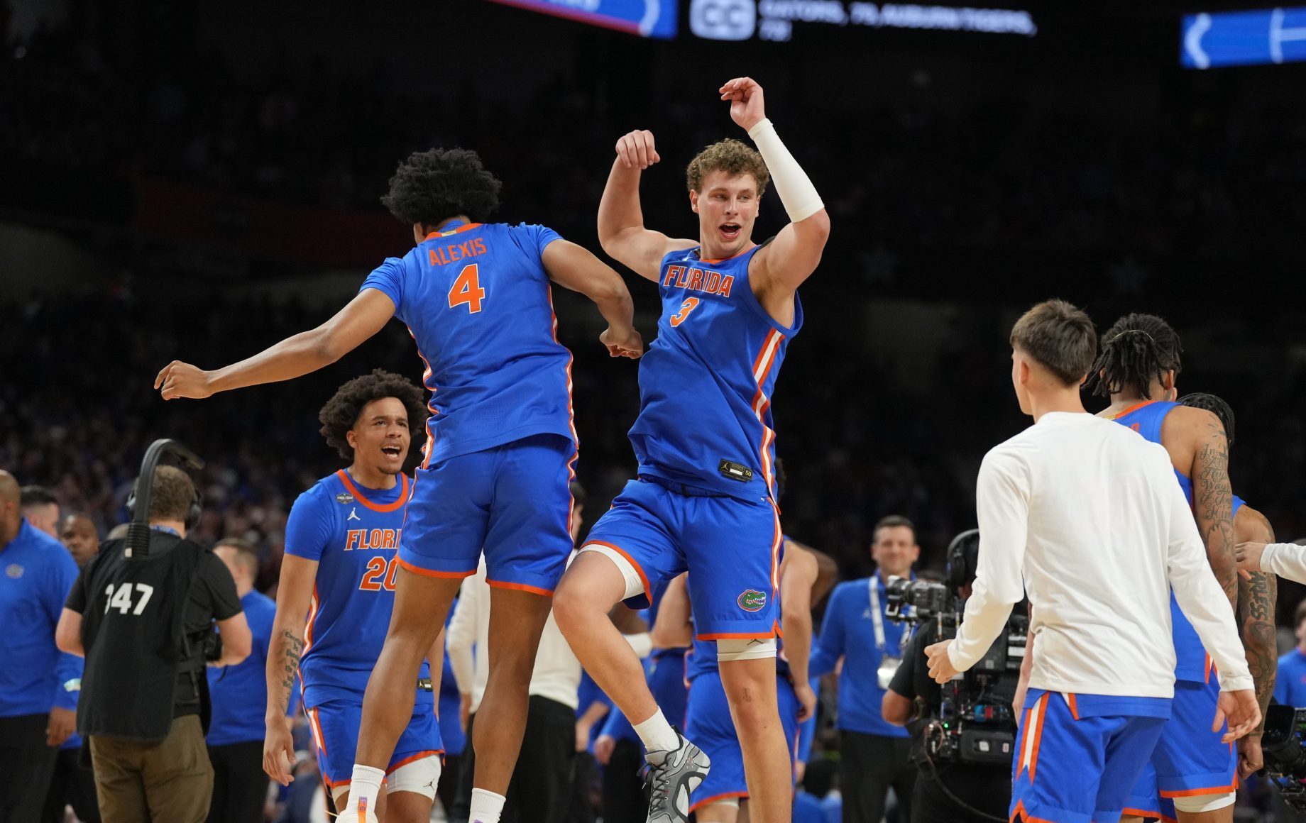 Apr 5, 2025; San Antonio, TX, USA; Florida Gators forward Sam Alexis (4) and Florida Gators center Micah Handlogten (3) celebrate after defeating the Auburn Tigers in the semifinals of the men's Final Four of the 2025 NCAA Tournament at the Alamodome.