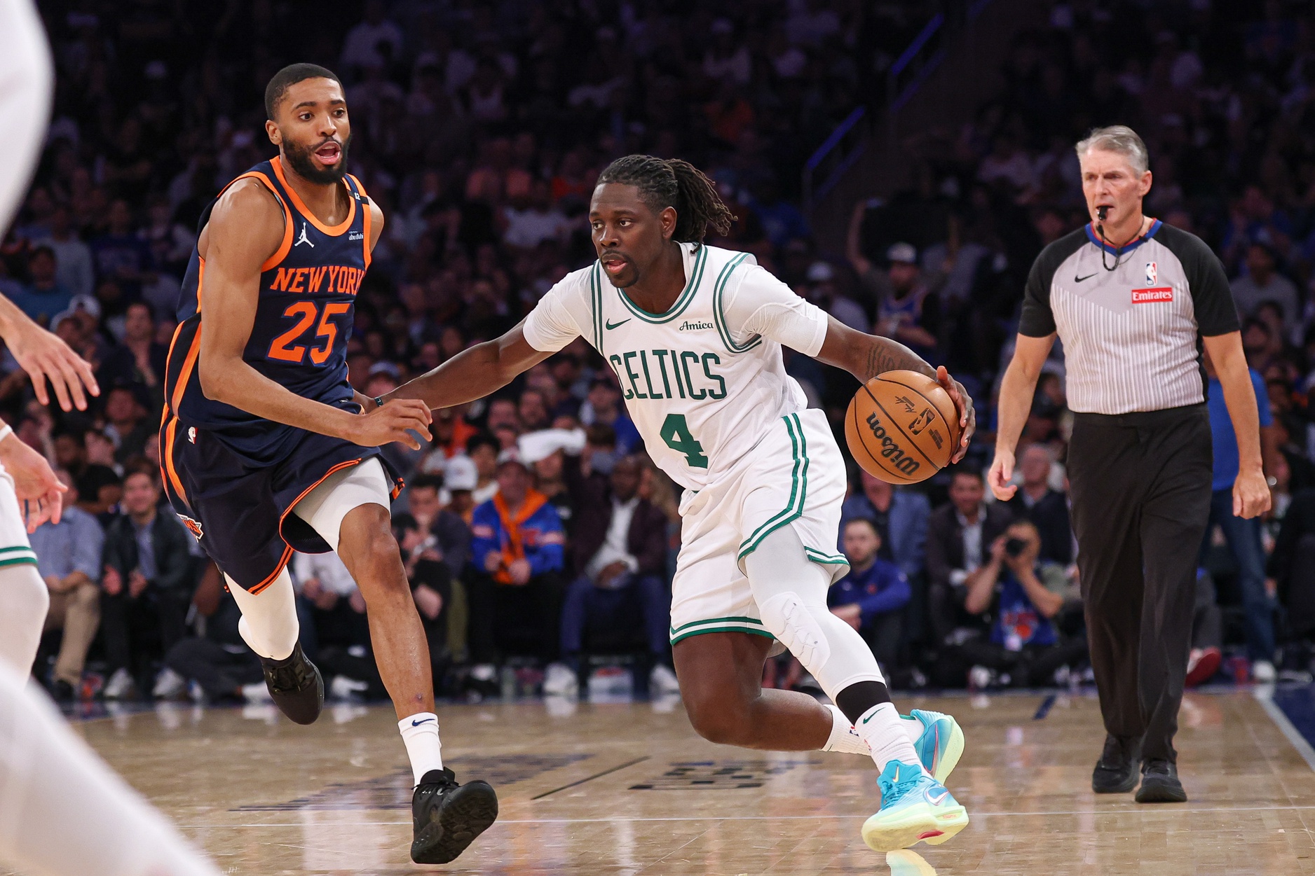 May 12, 2025; New York, New York, USA; Boston Celtics guard Jrue Holiday (4) dribbles in front of New York Knicks forward Mikal Bridges (25) in the second half during game four of the second round for the 2025 NBA Playoffs at Madison Square Garden.