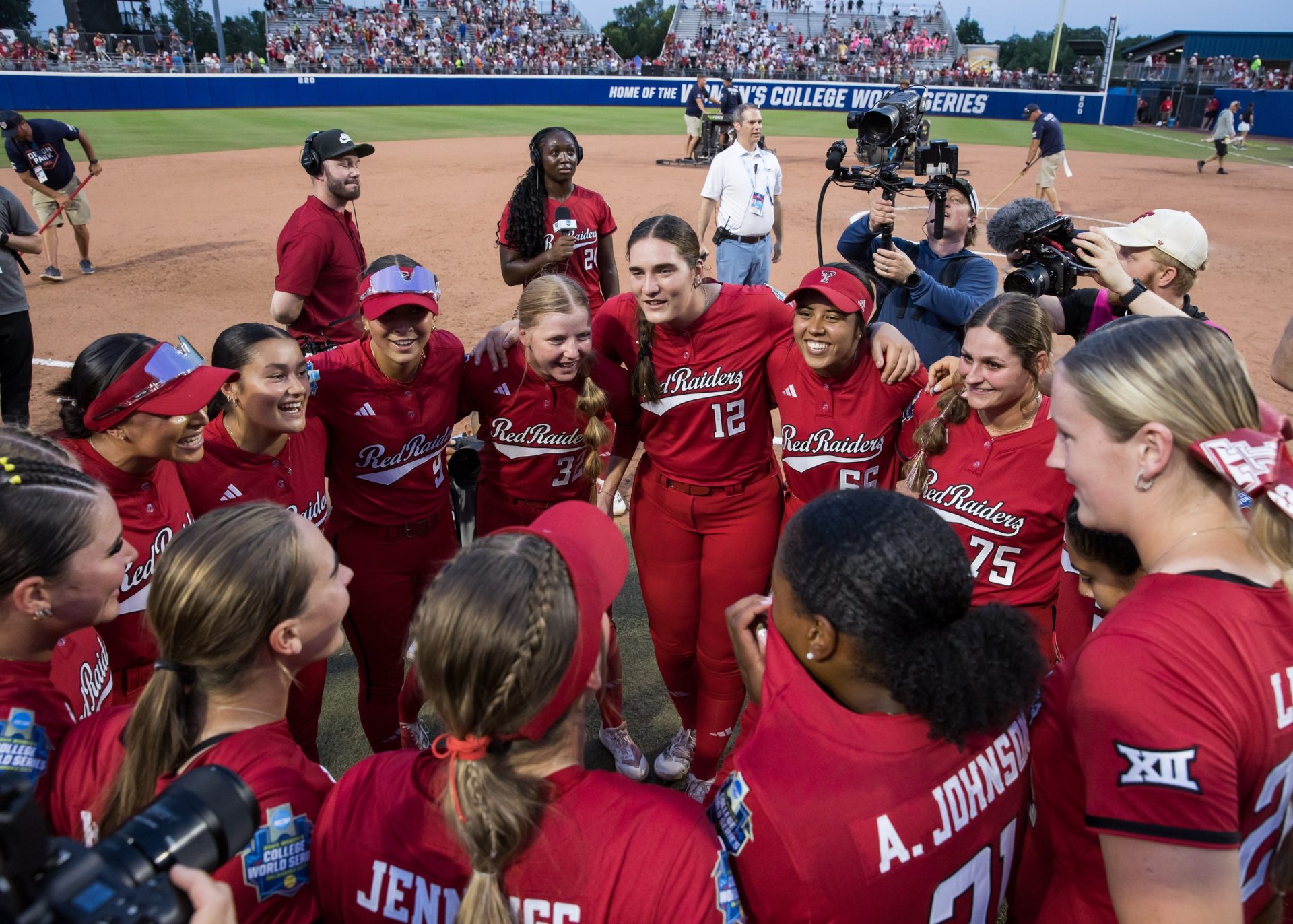 Jun 2, 2025; Oklahoma City, OK, USA; Texas Tech Red Raiders players celebrate after defeating the Oklahoma Sooners 3-2 and advance to the finals against Texas in the NCAA Softball Women's College World Series semifinal game at Devon Park.