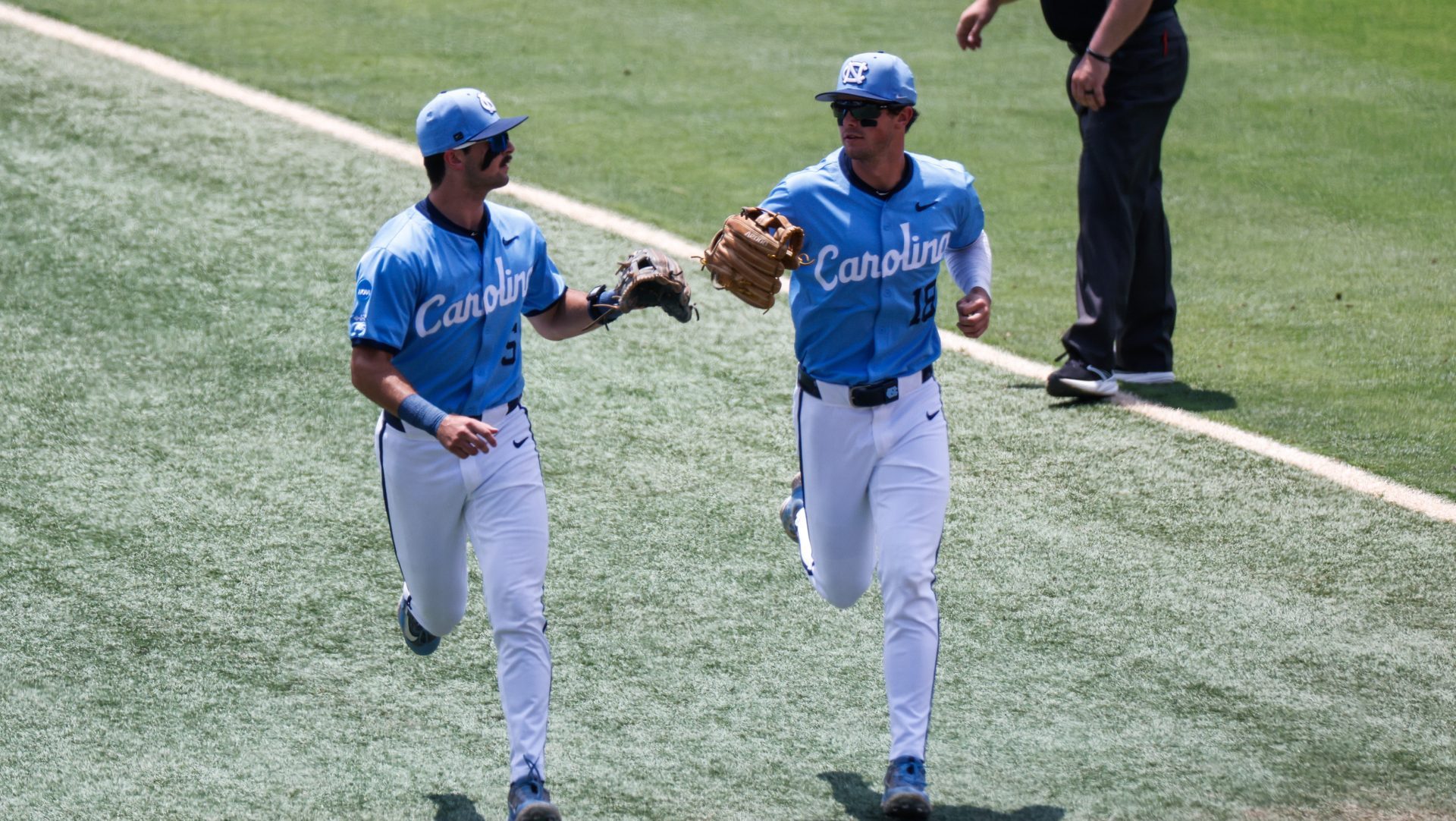 Jun 7, 2025; Chapel Hill, NC, USA; North Carolina infielder Jackson Van De Brake (6) and outfielder Carter French (18) celebrate an out during the first inning of the Super Regionals game against Arizona in Chapel Hill, North Carolina.