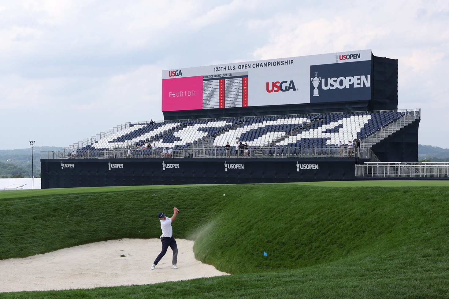 Jun 9, 2025; Oakmont, Pennsylvania, USA; Justin Rose plays a shot out of a bunker on the 17th hole during a practice round for the U.S. Open golf tournament at Oakmont Country Club.