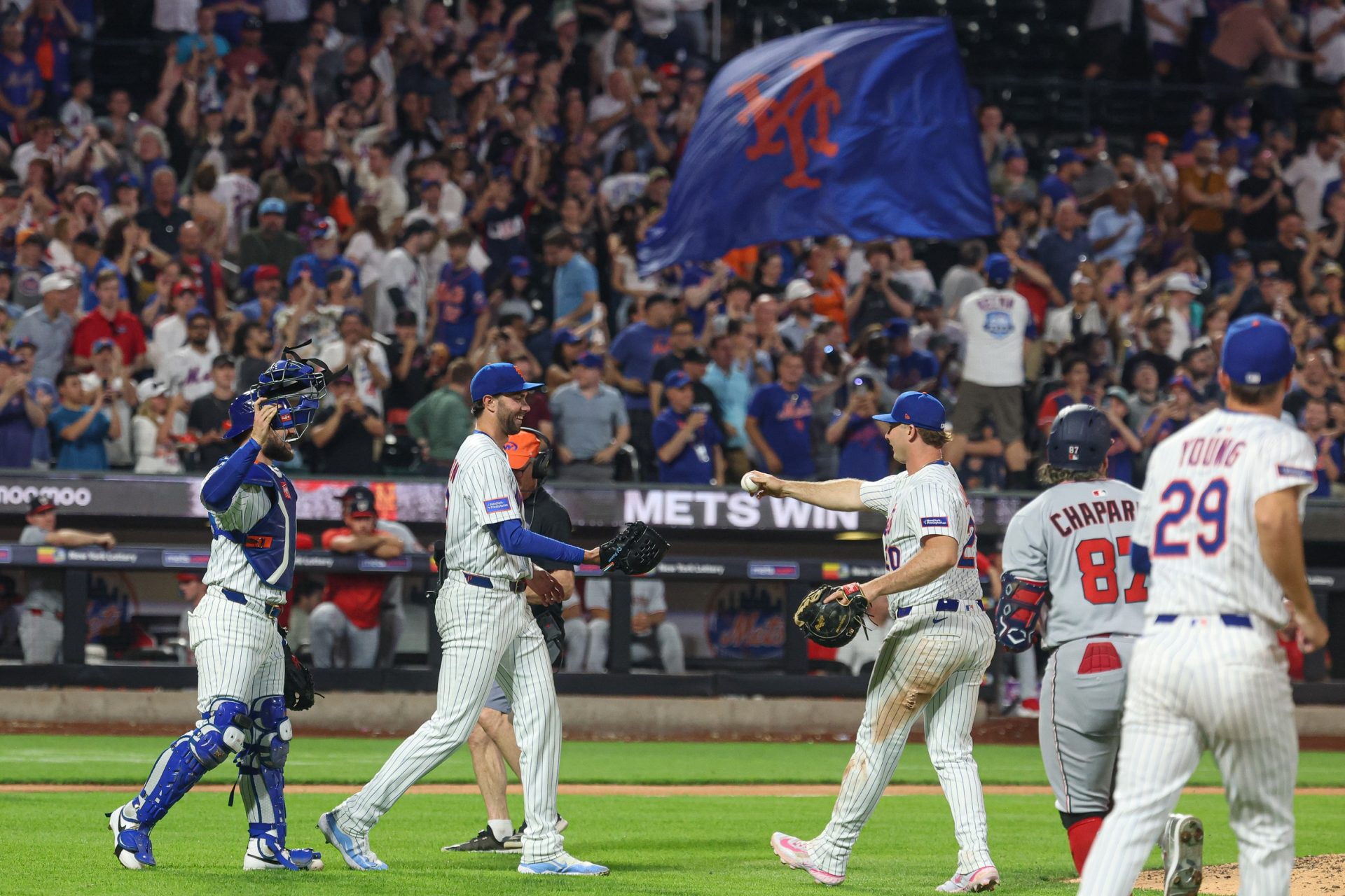 Jun 11, 2025; New York City, New York, USA; New York Mets starting pitcher David Peterson (23) celebrates with teammates after defeating the Washington Nationals at Citi Field.
