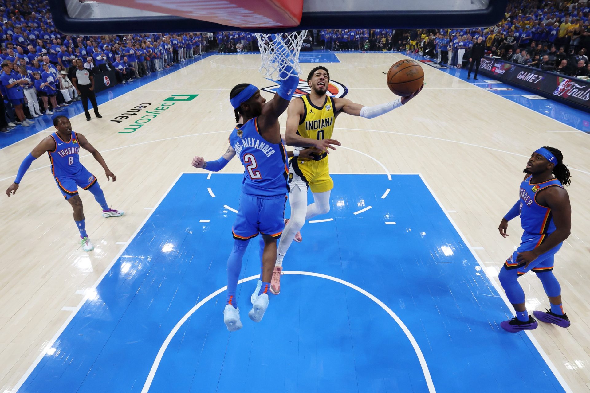 Jun 22, 2025; Oklahoma City, Oklahoma, USA; Indiana Pacers guard Tyrese Haliburton (0) drives to the basket against Oklahoma City Thunder guard Shai Gilgeous-Alexander (2) during game seven of the 2025 NBA Finals at Paycom Center.