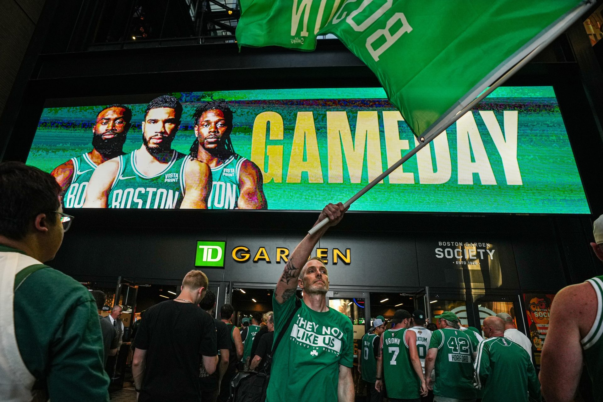 Waving a Celtics flag before the start of game five of the 2024 NBA Finals at TD Garden. The Celtics split up their championship team in the 2025 offseason to get under the second apron.