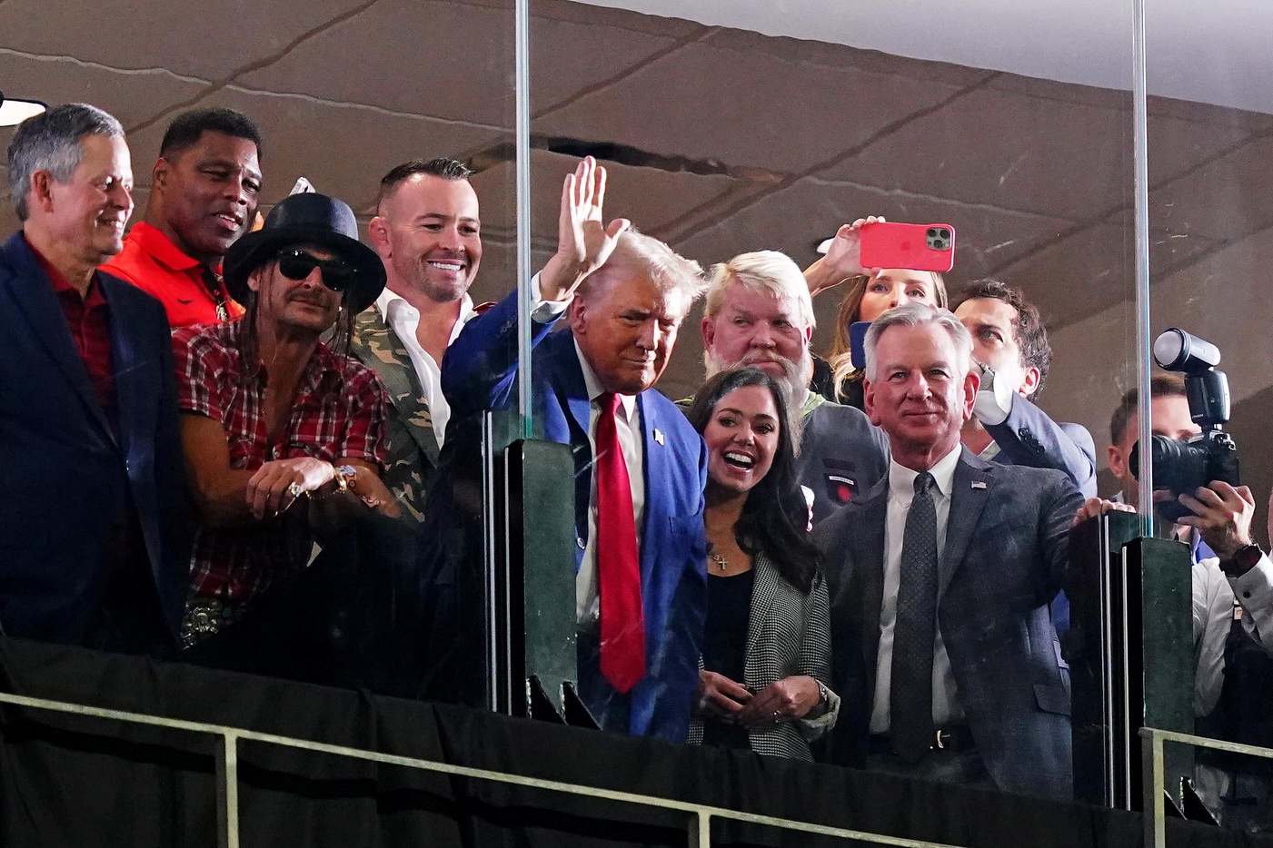Sep 28, 2024; Tuscaloosa, Alabama, USA; GOP Presidential candidate Donald Trump waves flanked by former Georgia Bulldogs player Herschel Walker, recording art Kid Rock, professional golfer John Daily, Alabama senators Tommy Tuberville (R) and Katie Britt (R) during the second half of the game between the Alabama Crimson Tide and the Georgia Bulldogs at Bryant-Denny Stadium.