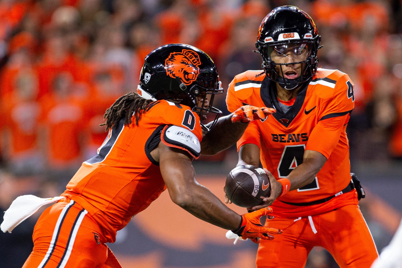 Oregon State Beavers quarterback Gevani McCoy (40) hands the ball to his running back Anthony Hankerson (0) during an NCAA football game against UNLV at Reser Stadium on Saturday, Oct. 19, 2024, in Corvallis, Ore.