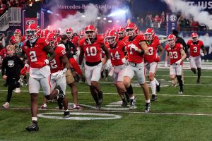 Georgia takes the field for the first half of the SEC championship game against Texas in Atlanta, on Saturday, Dec. 7, 2024.