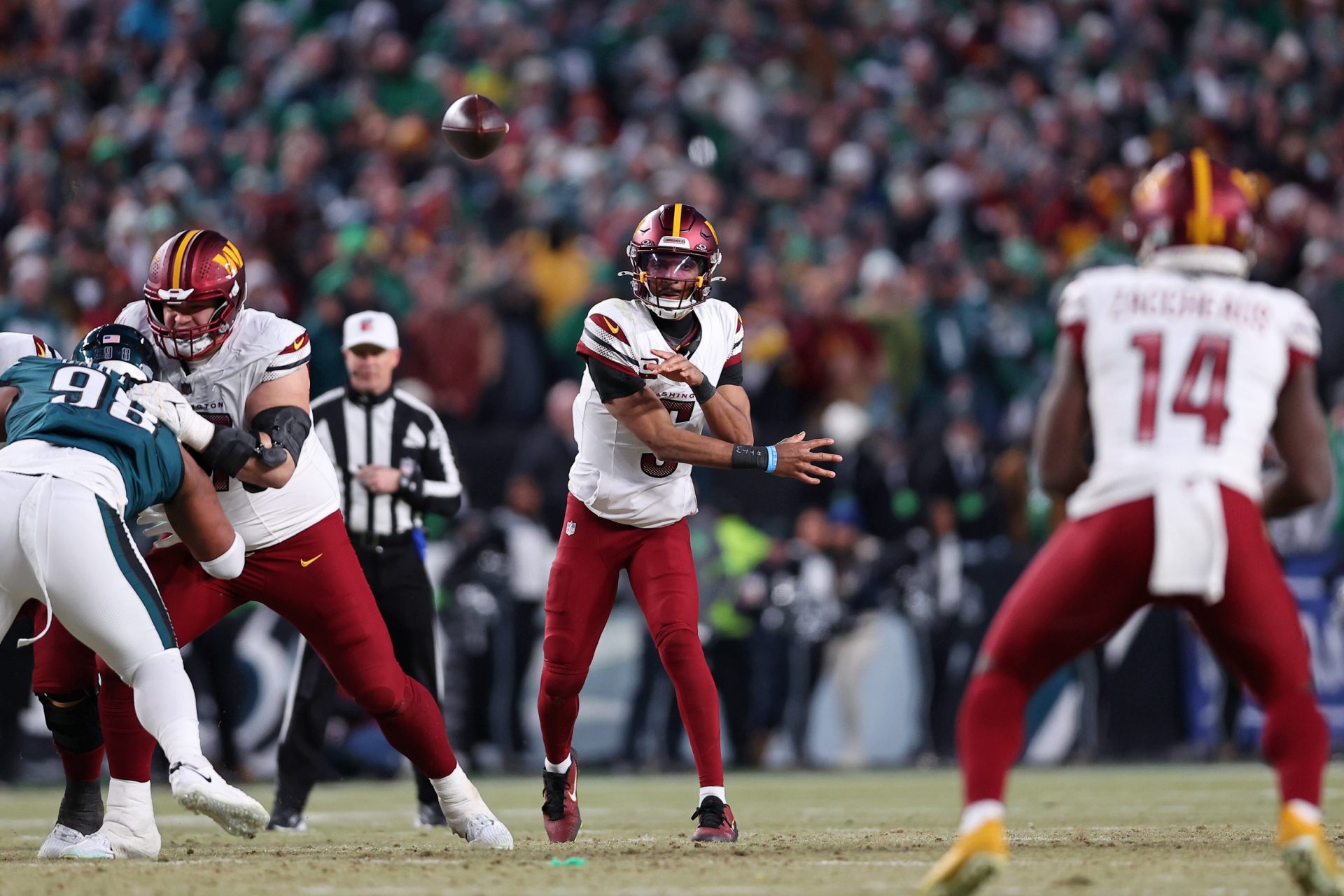 Jan 26, 2025; Philadelphia, PA, USA; Washington Commanders quarterback Jayden Daniels (5) passes the ball against the Philadelphia Eagles during the second half in the NFC Championship game at Lincoln Financial Field.