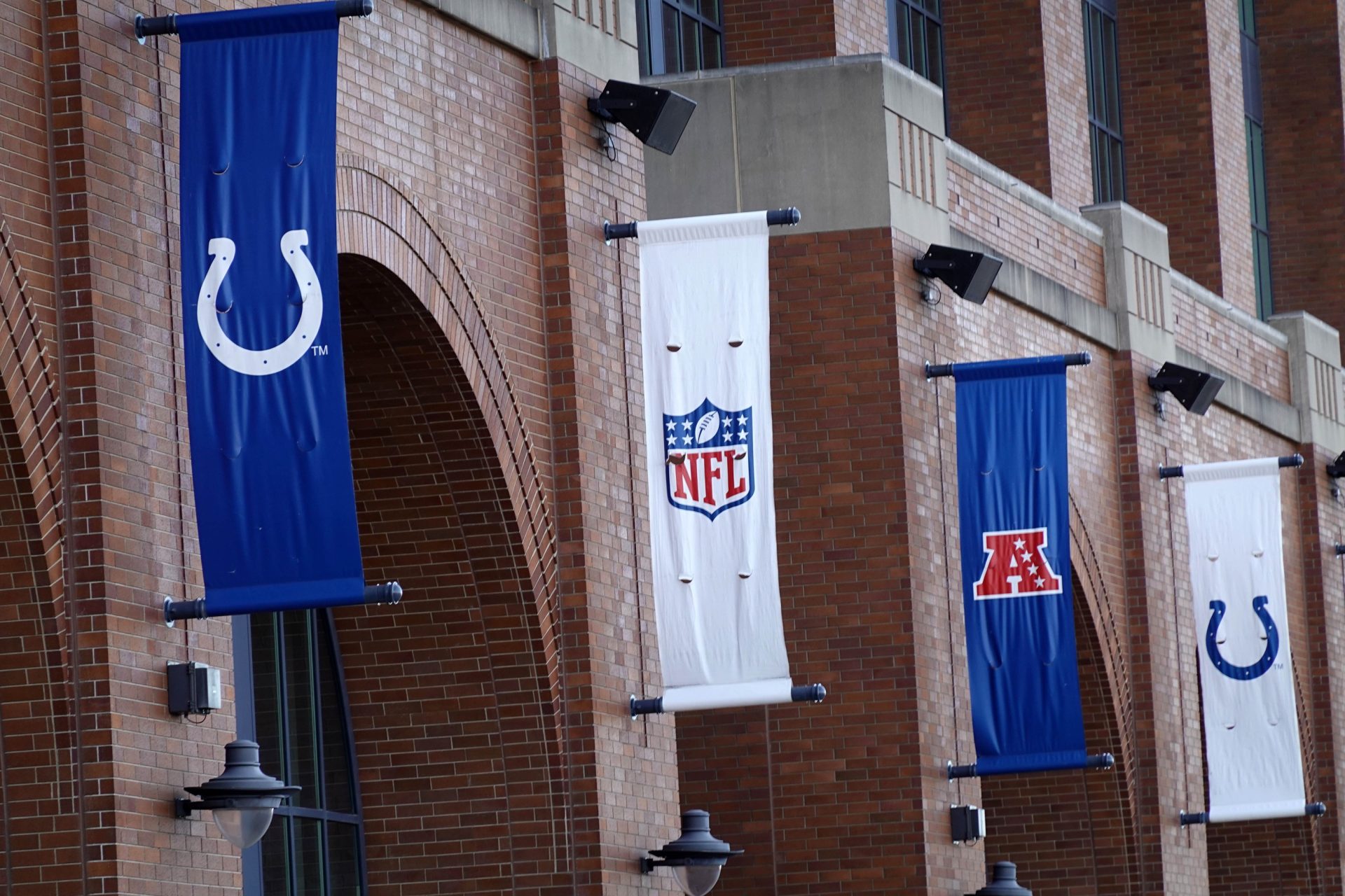 Feb 28, 2025; Indianapolis, IN, USA; Indianapolis Colts, NFL shield logo and AFC banners at Lucas Oil Stadium.