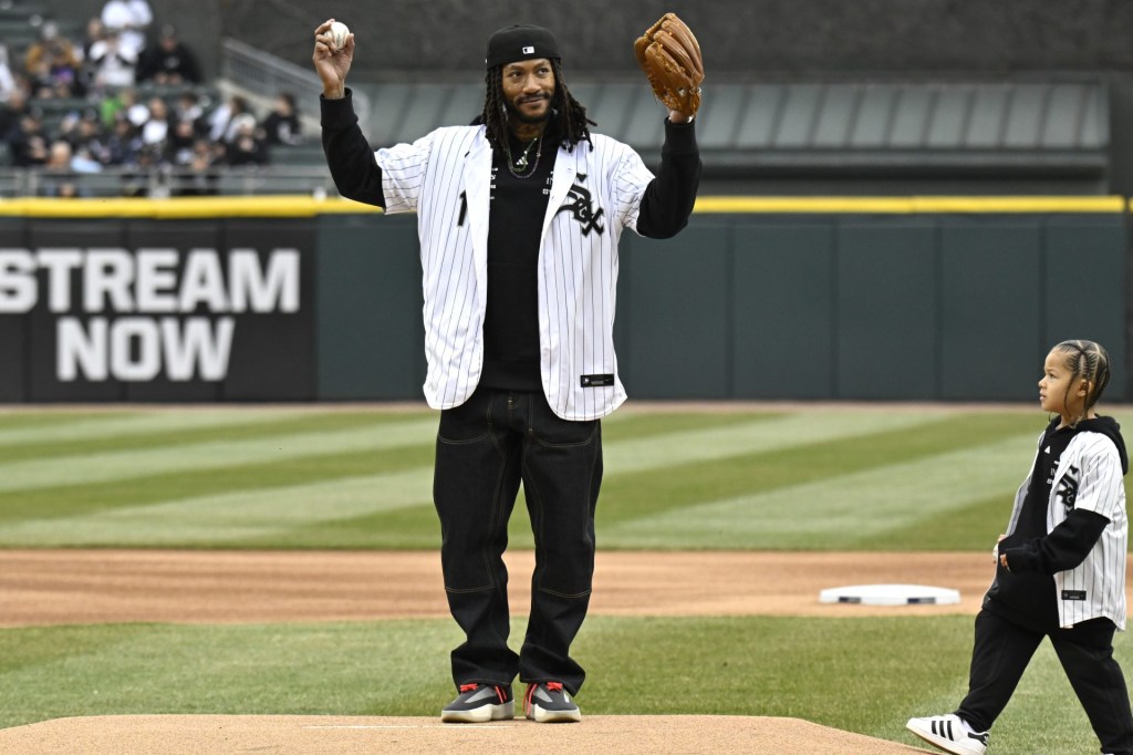 Mar 27, 2025; Chicago, Illinois, USA; Former Chicago Bulls player Derrick Rose throws out a ceremonial first pitch during the Chicago White Sox Opening day ceremony at Guaranteed Rate Field.