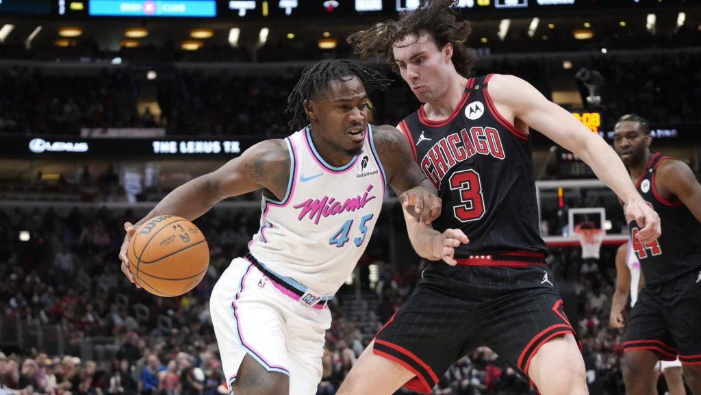 Apr 9, 2025; Chicago, Illinois, USA; Chicago Bulls guard Josh Giddey (3) defends Miami Heat guard Davion Mitchell (45) during the second half at United Center.