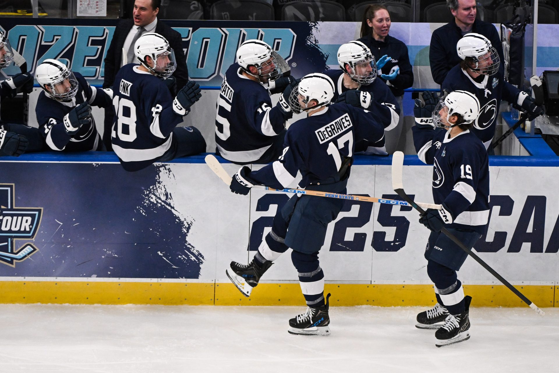 Louis, Missouri, UNITED STATES; Penn State Nittany Lions forward Nicholas DeGraves (17) celebrates with teammates after scoring a goal against the Boston University Terriers during the third period of the Frozen Four college ice hockey national semifinals at Enterprise Center
