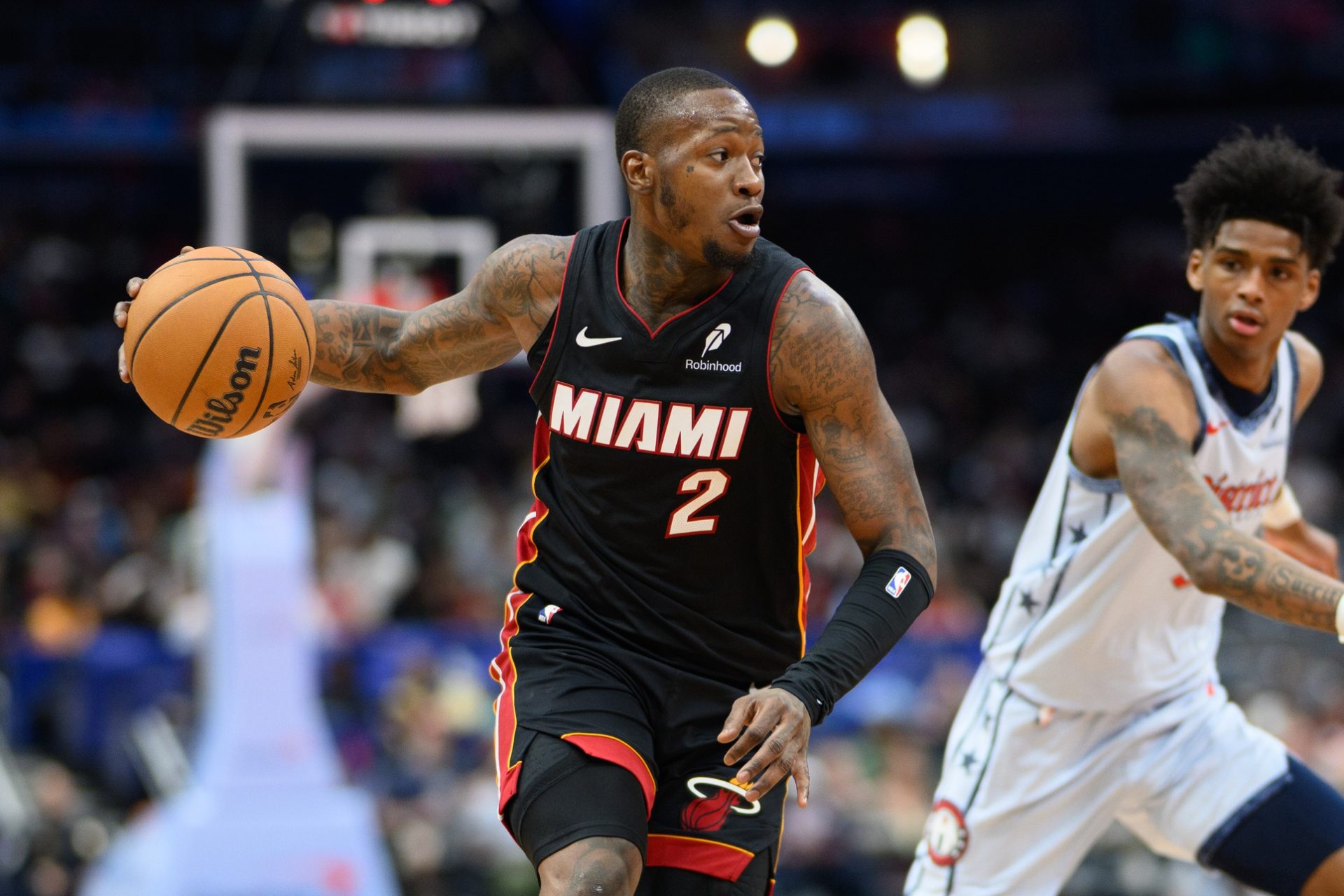 Mar 31, 2025; Washington, District of Columbia, USA; Miami Heat guard Terry Rozier (2) drives to the basket against Washington Wizards guard AJ Johnson (5) during the first quarter at Capital One Arena.