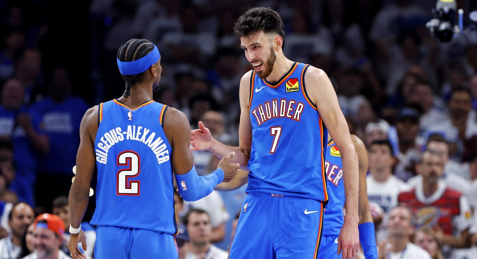 May 28, 2025; Oklahoma City, Oklahoma, USA; Oklahoma City Thunder forward Chet Holmgren (7) and guard Shai Gilgeous-Alexander (2) celebrates during the second quarter against the Minnesota Timberwolves in game five of the western conference finals for the 2025 NBA Playoffs at Paycom Center.