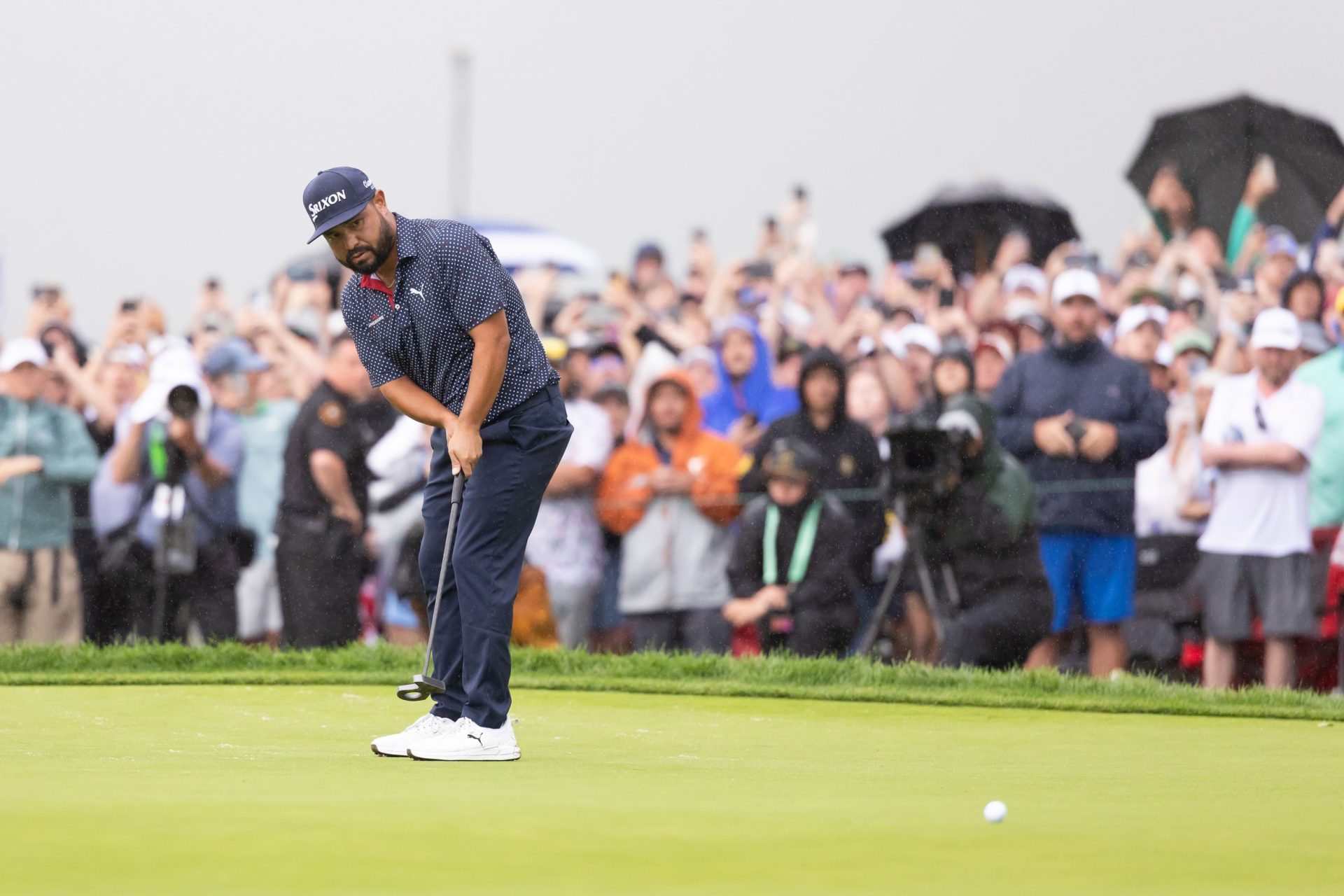 Jun 15, 2025; Oakmont, Pennsylvania, USA; JJ Spaun putts on the 18th green to win during the final round of the U.S. Open golf tournament.
