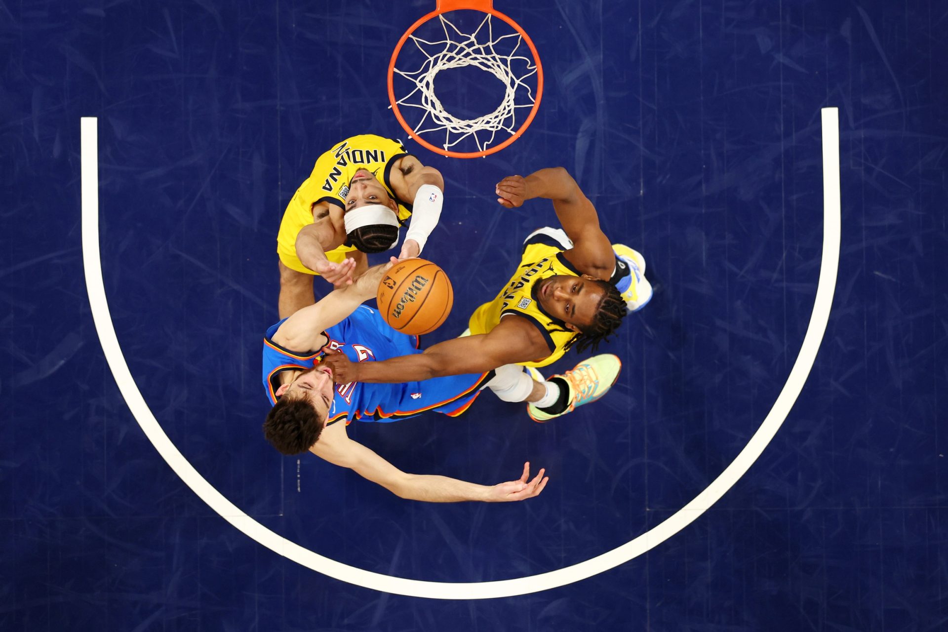 Jun 19, 2025; Indianapolis, Indiana, USA; Indiana Pacers guard Andrew Nembhard (2) drives to the basket against Oklahoma City Thunder forward Chet Holmgren (7) during the third quarter during game six of the 2025 NBA Finals at Gainbridge Fieldhouse.
