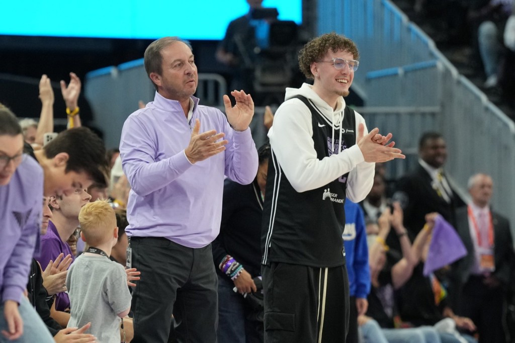 Jun 29, 2025; San Francisco, California, USA; Golden State Valkyries owner Peter Lacob (left) and Golden State Warriors guard Brandin Podziemski (right) cheer during the third quarter against the Seattle Storm at Chase Center