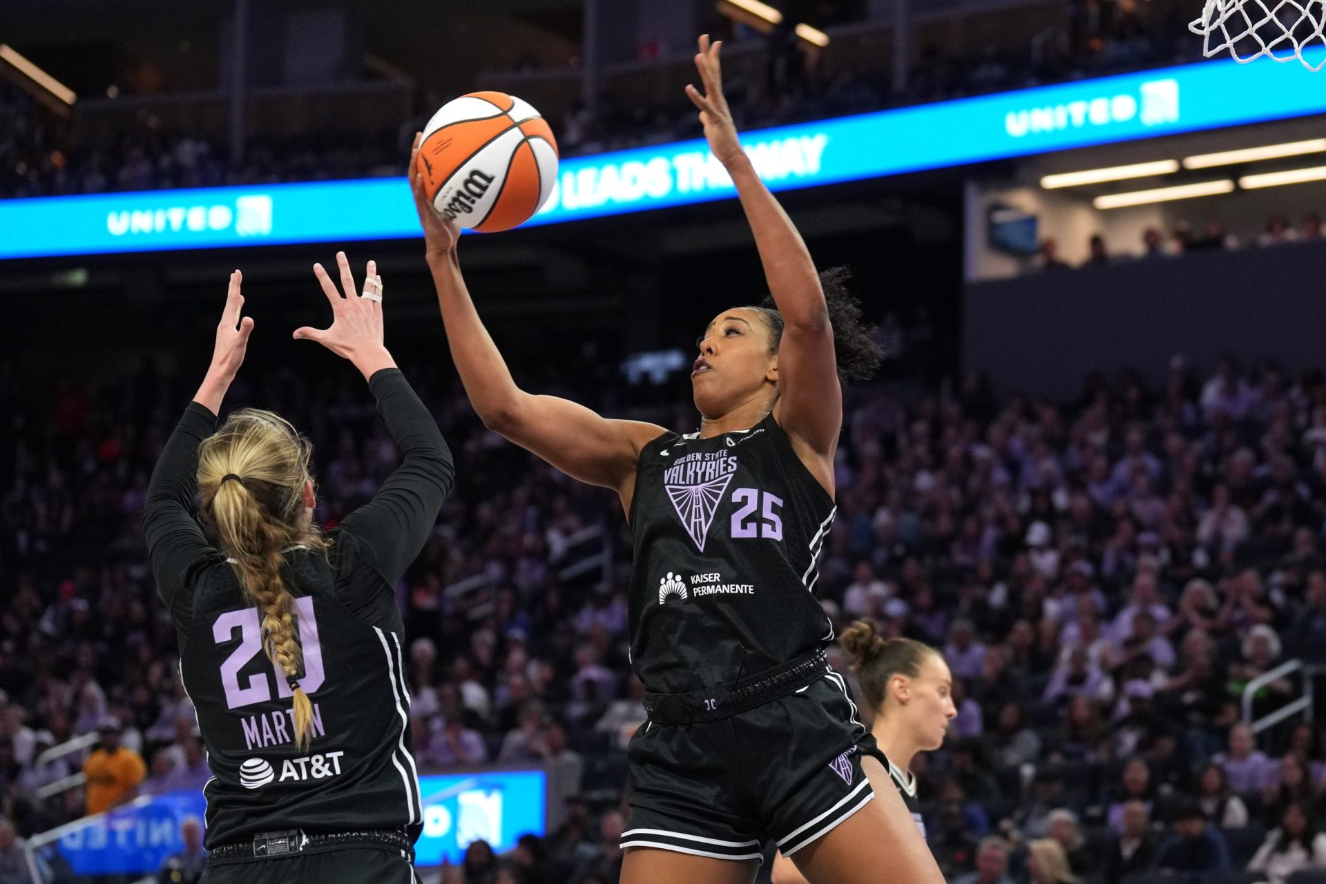 Jun 29, 2025; San Francisco, California, USA; Golden State Valkyries forward Monique Billings (25) rebounds with guard Kate Martin (20) during the third quarter against the Seattle Storm at Chase Center.