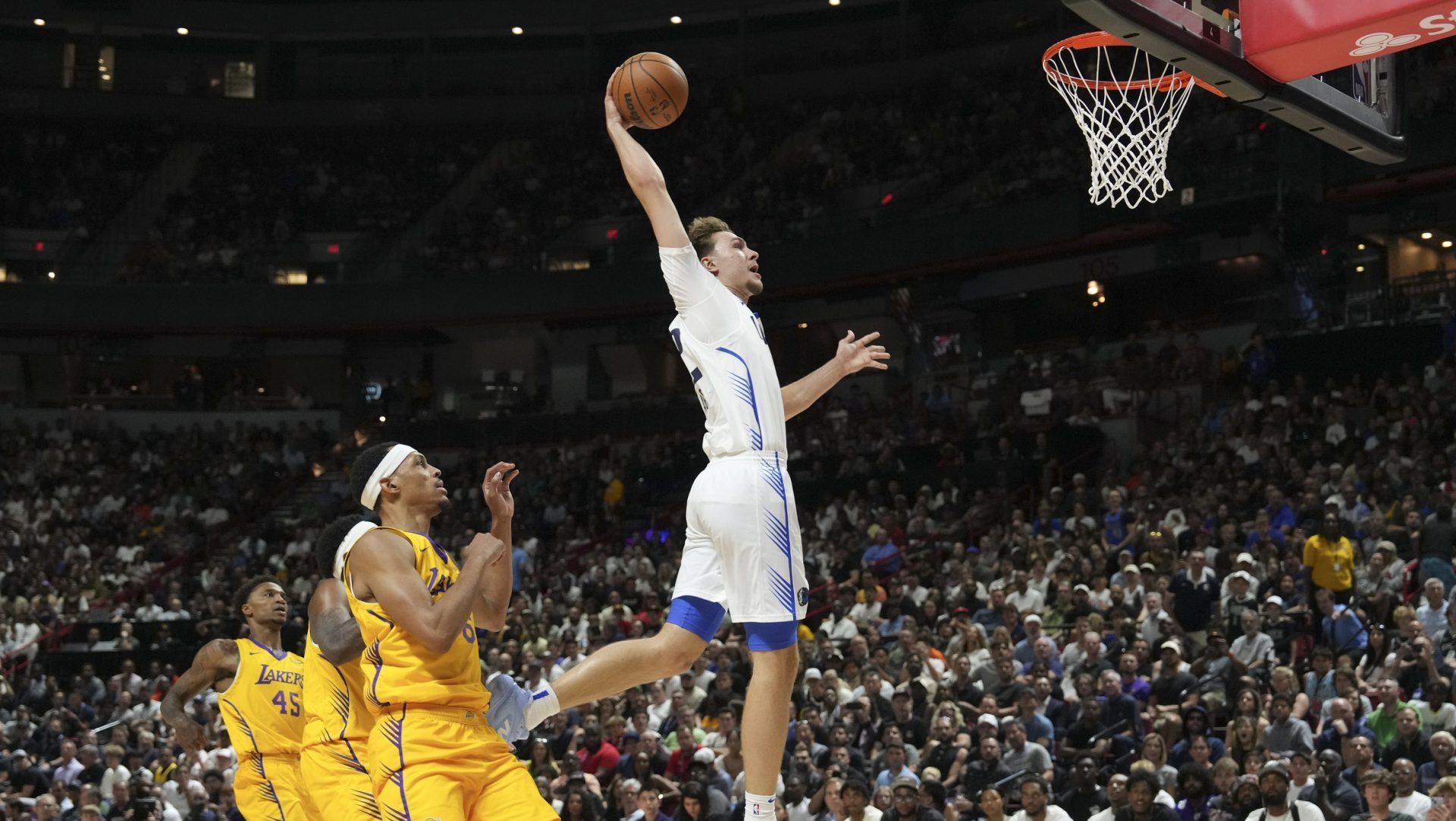 Jul 10, 2025; Las Vegas, NV, USA; Dallas Mavericks forward Cooper Flagg (32) dunks against the Los Angeles Lakers in the first quarter of their game at Thomas & Mack Center.