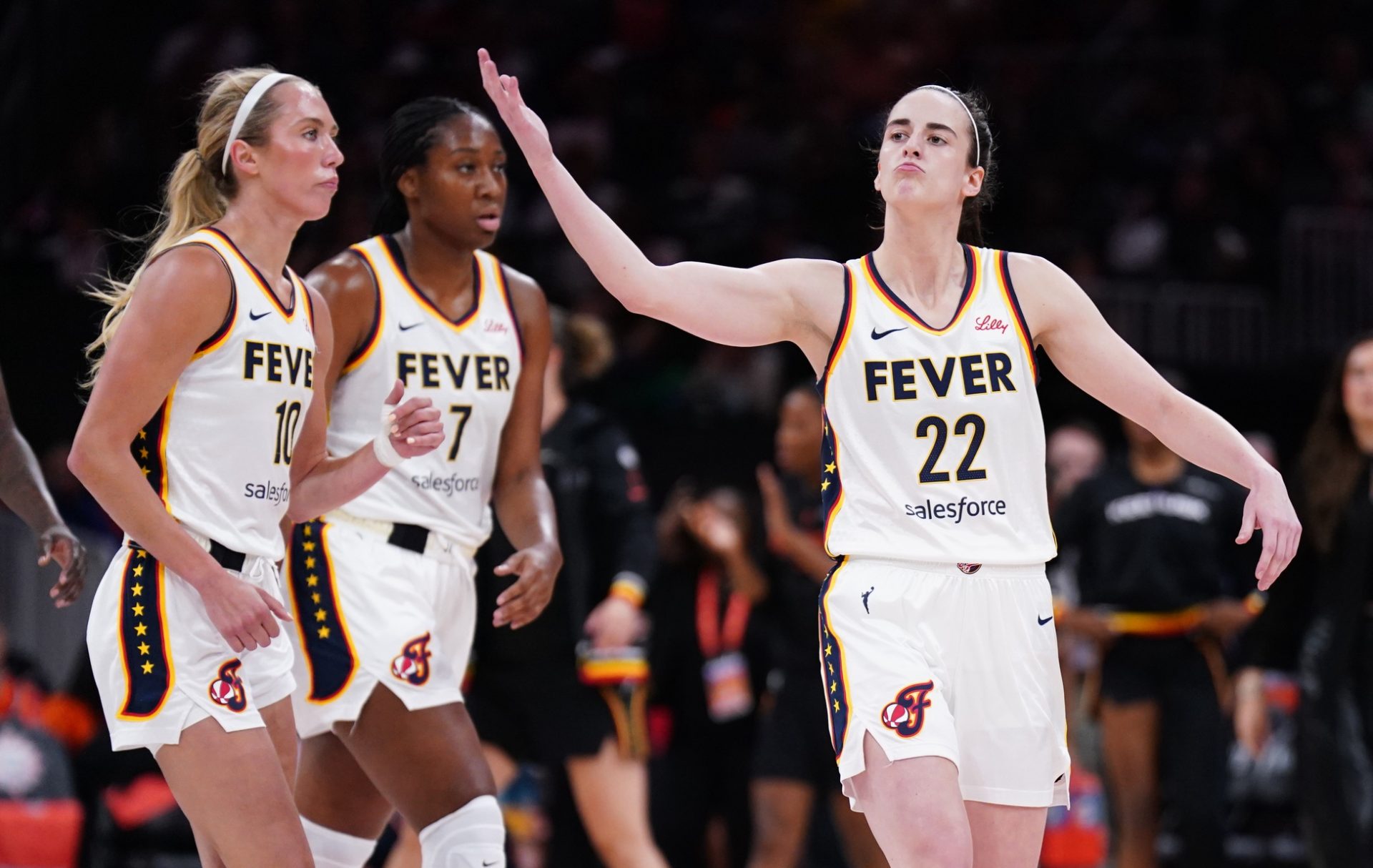 Jul 15, 2025; Boston, Massachusetts, USA; Indiana Fever guard Caitlin Clark (22) reacts to the crowd as they take on the Connecticut Sun in the first quarter at TD Garden.