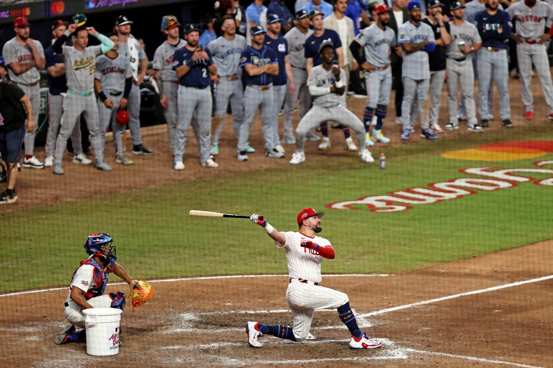 Jul 15, 2025; Cumberland, Georgia, USA; National League designated hitter Kyle Schwarber (12) of the Philadelphia Phillies hits a home run in the swing off of after the 2025 MLB All Star Game ended in a tie at Truist Park.