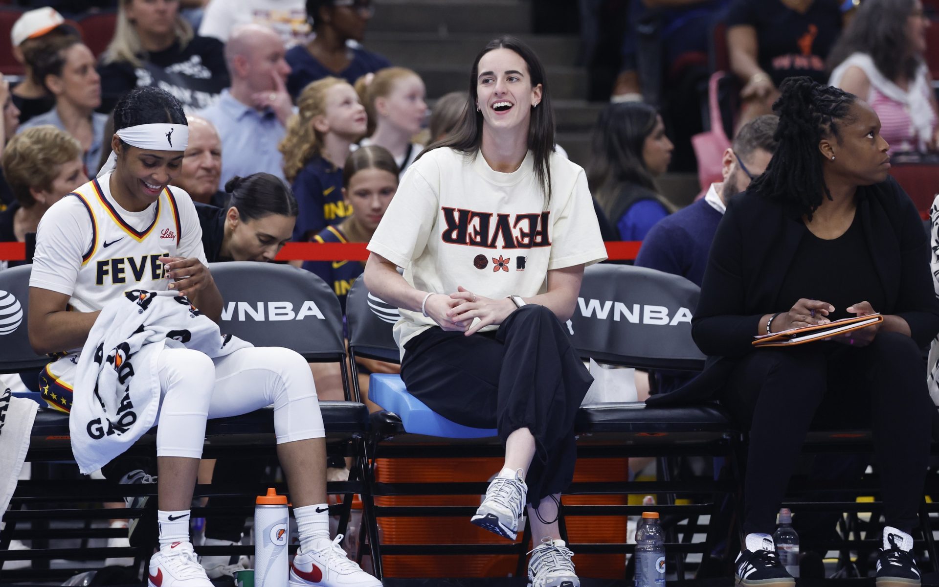 Jul 27, 2025; Chicago, Illinois, USA; Injured Indiana Fever guard Caitlin Clark (22) looks on from the bench during the first half of a basketball game against the Chicago Sky at United Center.