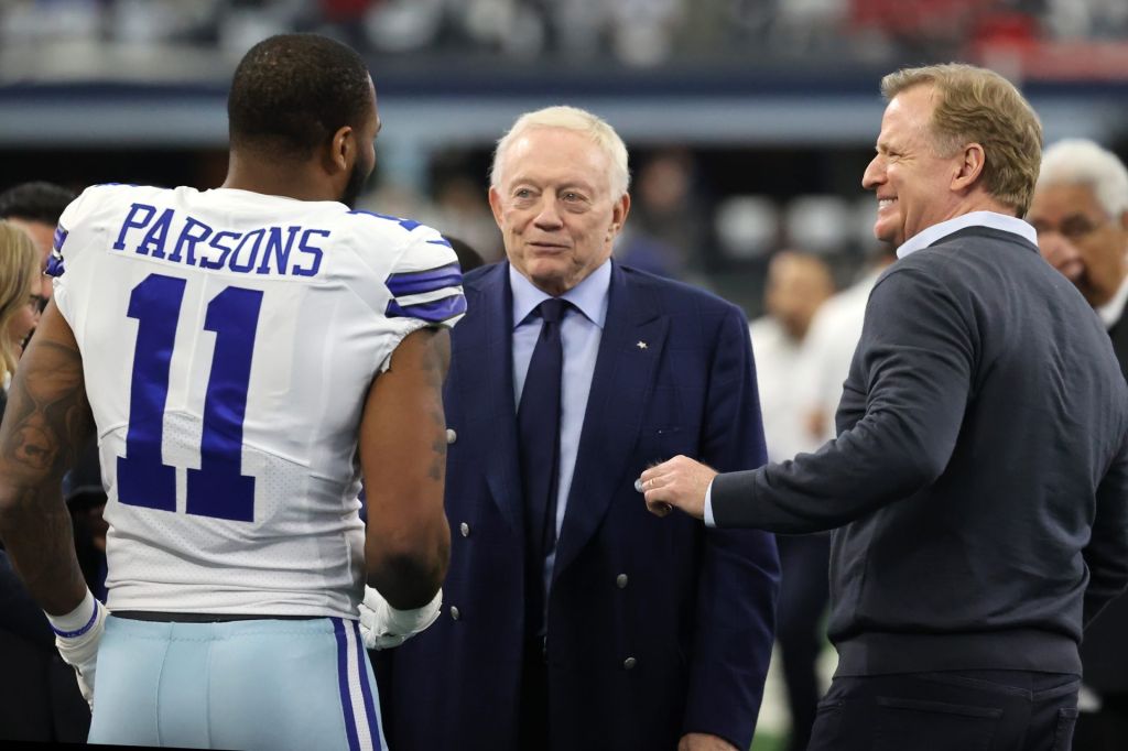 Jan 16, 2022; Arlington, Texas, USA; Dallas Cowboys outside linebacker Micah Parsons (11) meets with owner Jerry Jones (center) and NFL commissioner Roger Goodell (right) prior to the NFC Wild Card playoff football game against the San Francisco 49ers at AT&T Stadium. Mandatory