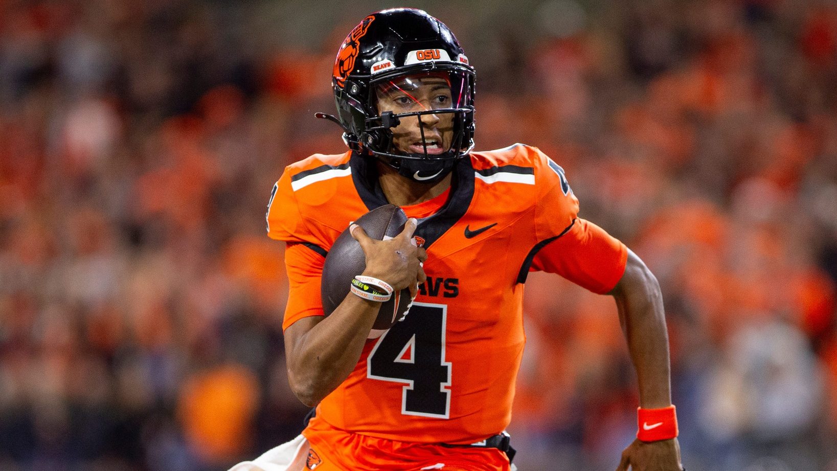 Oregon State Beavers quarterback Gevani McCoy (4) scrambles out of the pocket during an NCAA football game against UNLV at Reser Stadium on Saturday, Oct. 19, 2024, in Corvallis, Ore.
