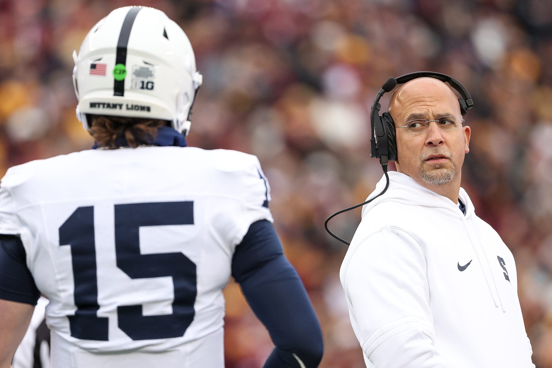 Nov 23, 2024; Minneapolis, Minnesota, USA; Penn State Nittany Lions head coach James Franklin looks at quarterback Drew Allar (15) during the first quarter against the Minnesota Golden Gophers at Huntington Bank Stadium.
