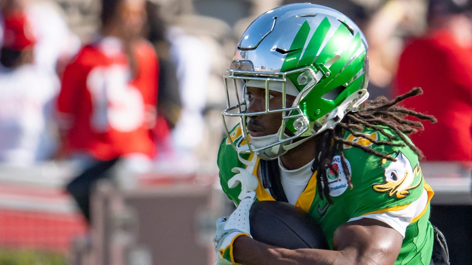 Oregon running back Noah Whittington carries the ball before the game as the Oregon Ducks face the Ohio State Buckeyes Wednesday, Jan. 1, 2025, in the quarterfinal of the College Football Playoff at the Rose Bowl in Pasadena, Calif.