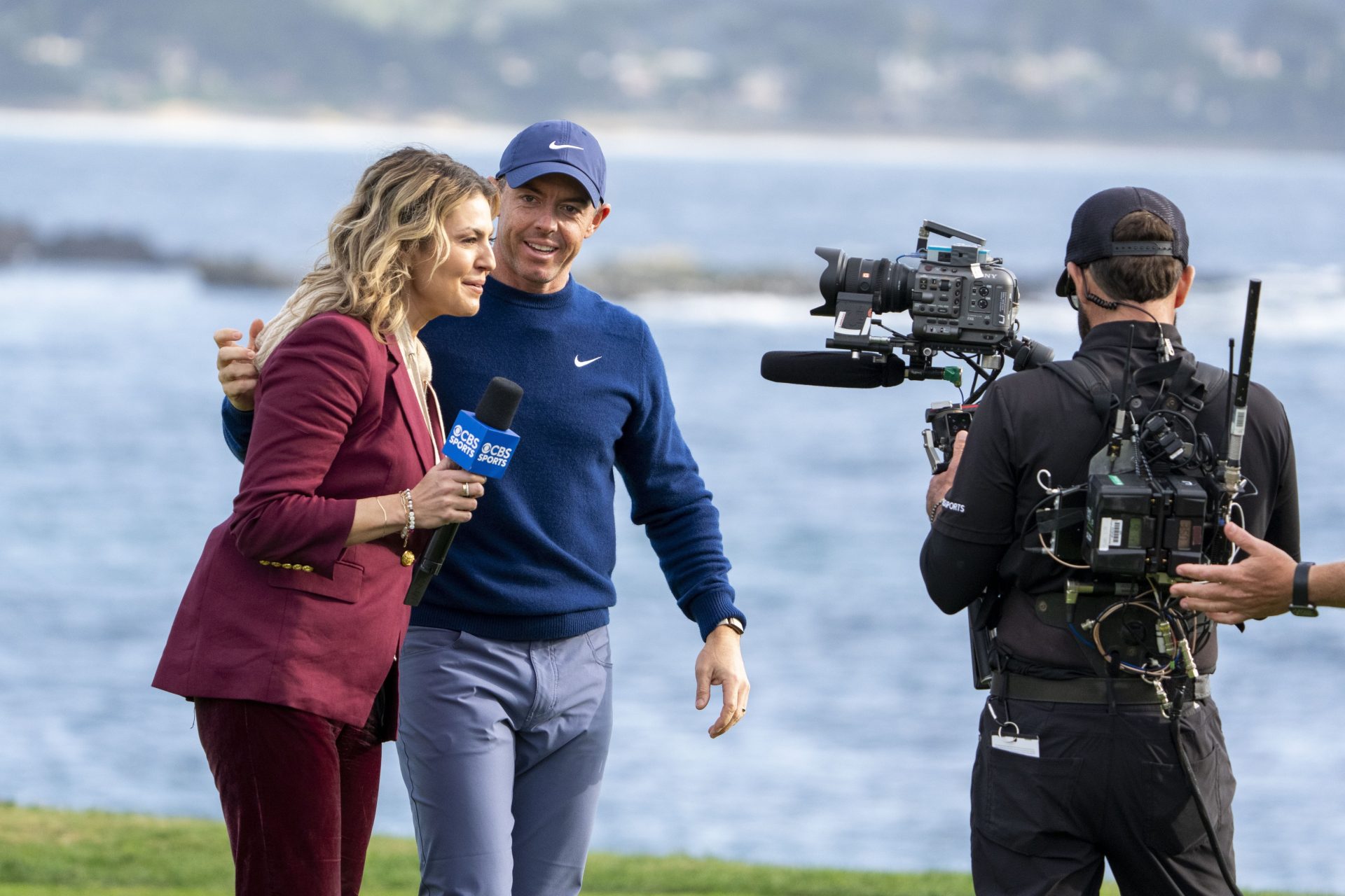 February 2, 2025; Pebble Beach, California, USA; Rory McIlroy (right) hugs CBS Sports reporter Amanda Balionis (left) during the final round of the AT&T Pebble Beach Pro-Am golf tournament at Pebble Beach Golf Links.