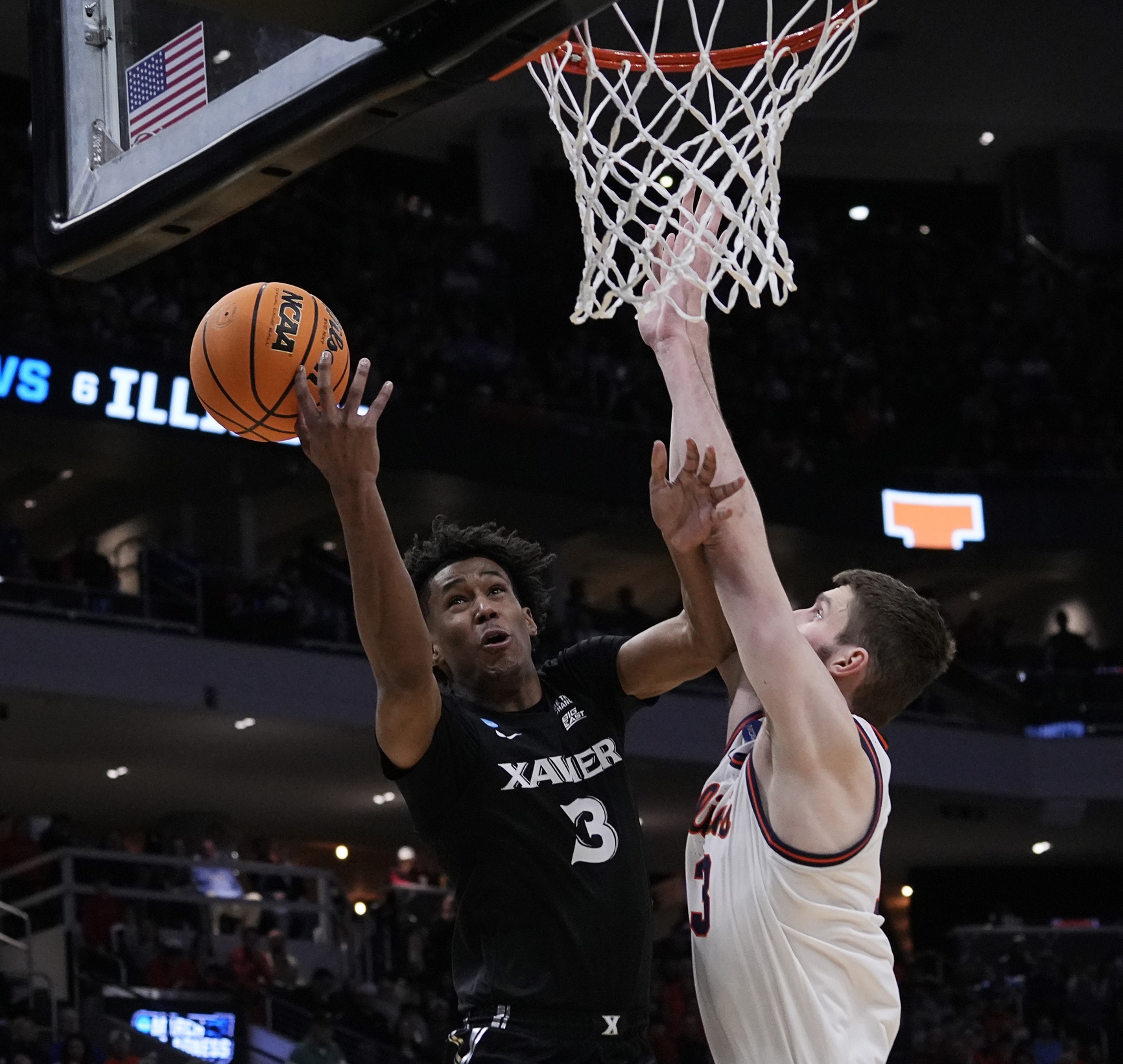 Mar 21, 2025; Milwaukee, WI, USA; Illinois center Tomislav Ivisic (13) attempts to block Xavier guard Dailyn Swain (3) during the second half of their first round NCAA men’ s basketball tournament game at Fiserv Forum.