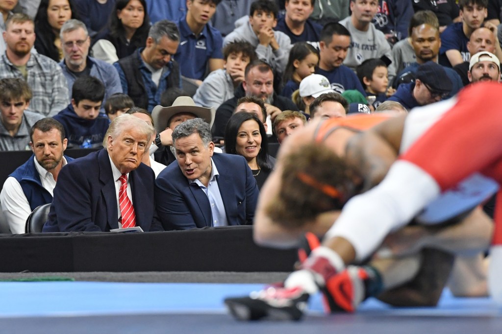Mar 22, 2025; Philadelphia, PA, USA; President Donald Trump and US Senator Dave McCormick watch the action during the Division I Men's Wrestling Championship held at Wells Fargo Center