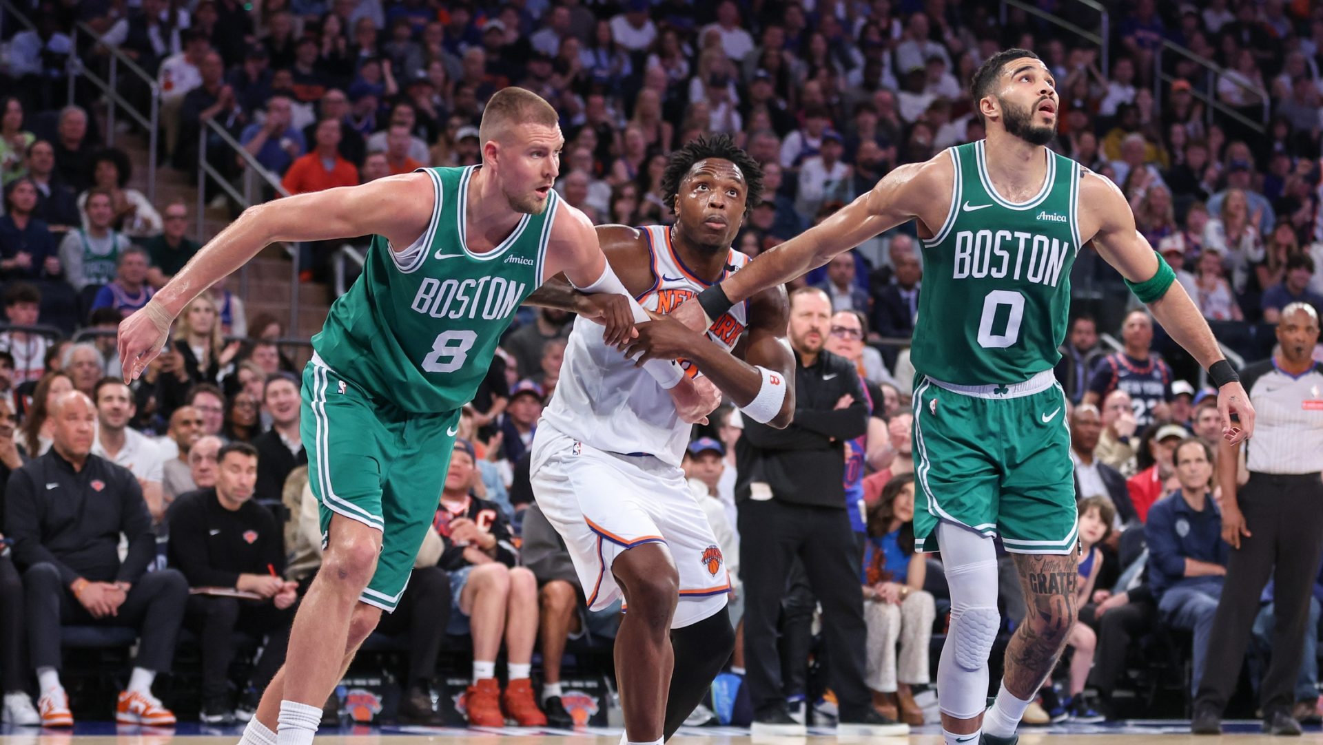 May 10, 2025; New York, New York, USA; Boston Celtics center Kristaps Porzingis (8), and forward Jayson Tatum (0) and New York Knicks forward OG Anunoby (8) during game three of the second round for the 2025 NBA Playoffs at Madison Square Garden.