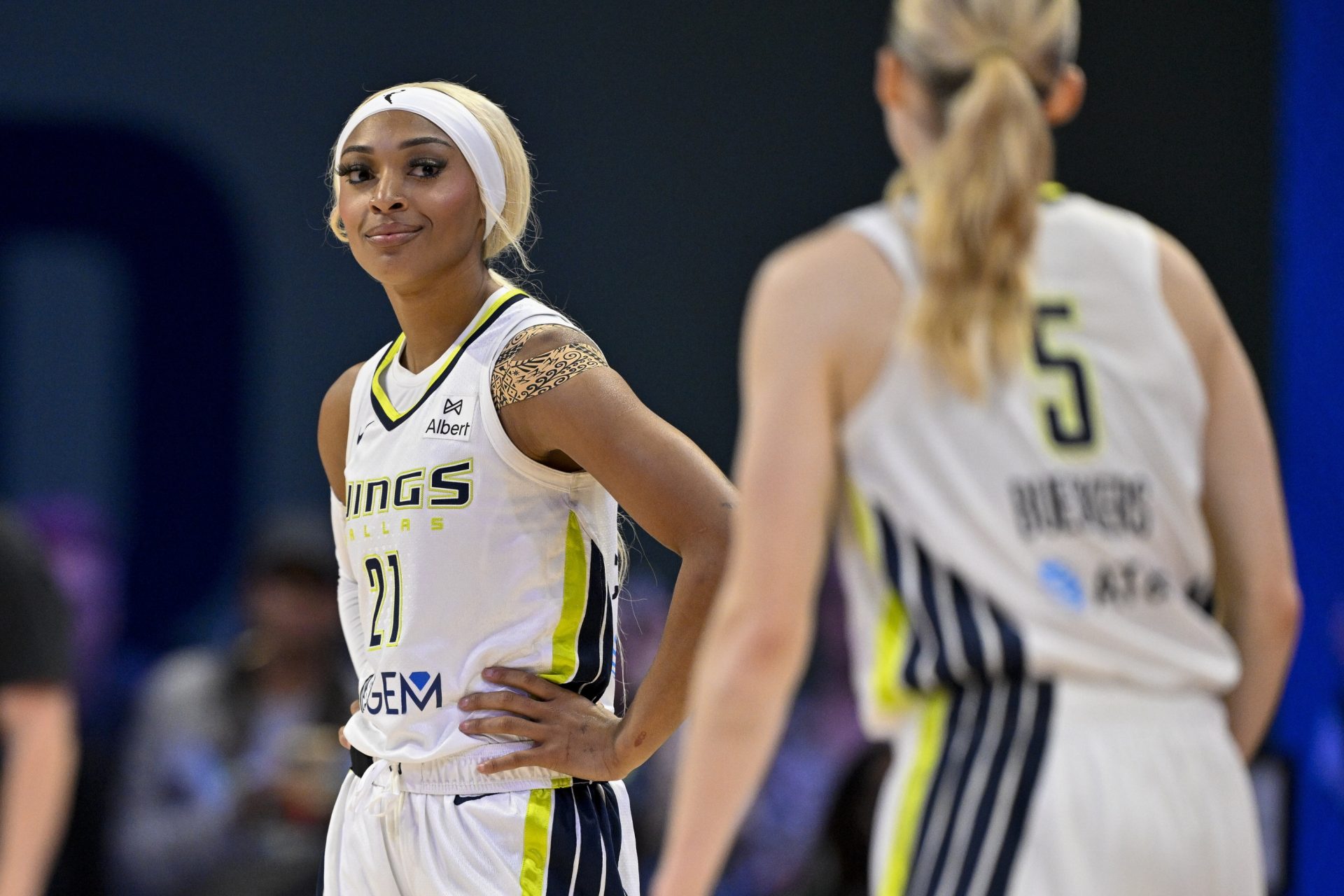 Jul 28, 2025; Arlington, Texas, USA; Dallas Wings guard Paige Bueckers (5) and guard DiJonai Carrington (21) during the game between the Dallas Wings and the New York Liberty at College Park Center.