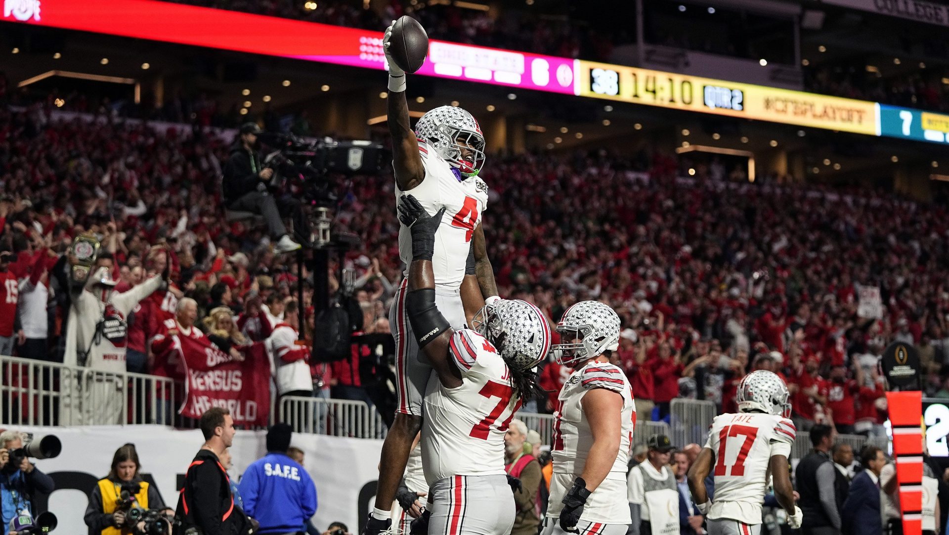 Ohio State Buckeyes wide receiver Jeremiah Smith (4) celebrates with offensive lineman Donovan Jackson (74) after a touchdown catch against Notre Dame Fighting Irish in the first quarter during the College Football Playoff National Championship at Mercedes-Benz Stadium in Atlanta on January 20, 2025.