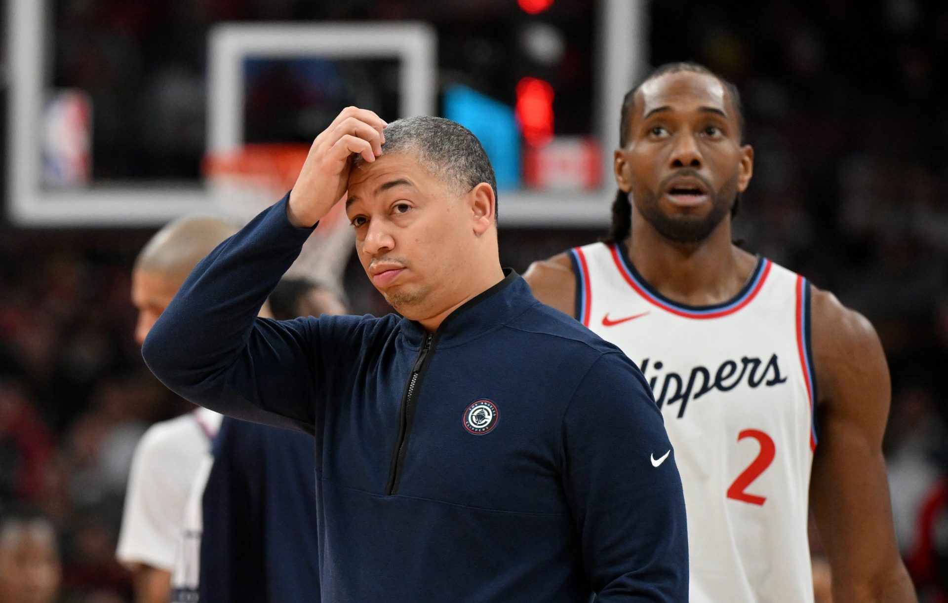 Feb 2, 2025; Toronto, Ontario, CAN; Los Angeles Clippers head coach Tyronn Lue scratches his head after calling a time out as forward Kawhi Leonard (2) walks past in the first half against the Toronto Raptors at Scotiabank Arena.