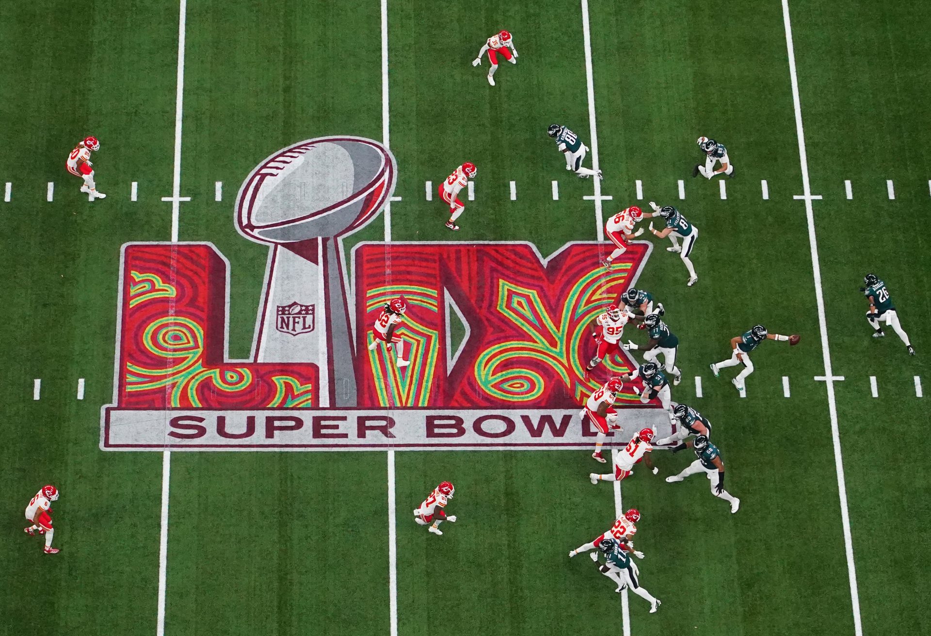 Feb 9, 2025; New Orleans, LA, USA; Philadelphia Eagles quarterback Jalen Hurts (1) fakes a hand off in the first quarter against the Kansas City Chiefs during Super Bowl LIX at Caesars Superdome.