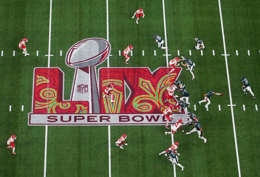 Feb 9, 2025; New Orleans, LA, USA; Philadelphia Eagles quarterback Jalen Hurts (1) fakes a hand off in the first quarter against the Kansas City Chiefs during Super Bowl LIX at Caesars Superdome.