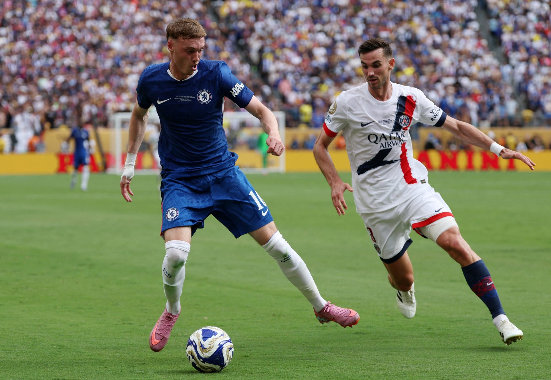 [Subscription Customers Only] Jul 13, 2025; East Rutherford, New Jersey, USA; Chelsea FC midfielder Cole Palmer (10) in action with Paris Saint-Germain midfielder Fabian Ruiz (8) during the final of the 2025 FIFA Club World Cup at MetLife Stadium.