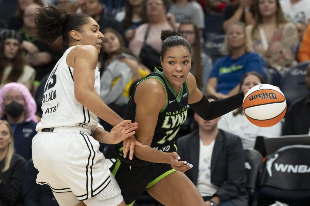 Sep 11, 2025; Minneapolis, Minnesota, USA; Minnesota Lynx forward Napheesa Collier (24) dribbles past Golden State Valkyries forward Janelle Salaun (13) in the second half at Target Center.