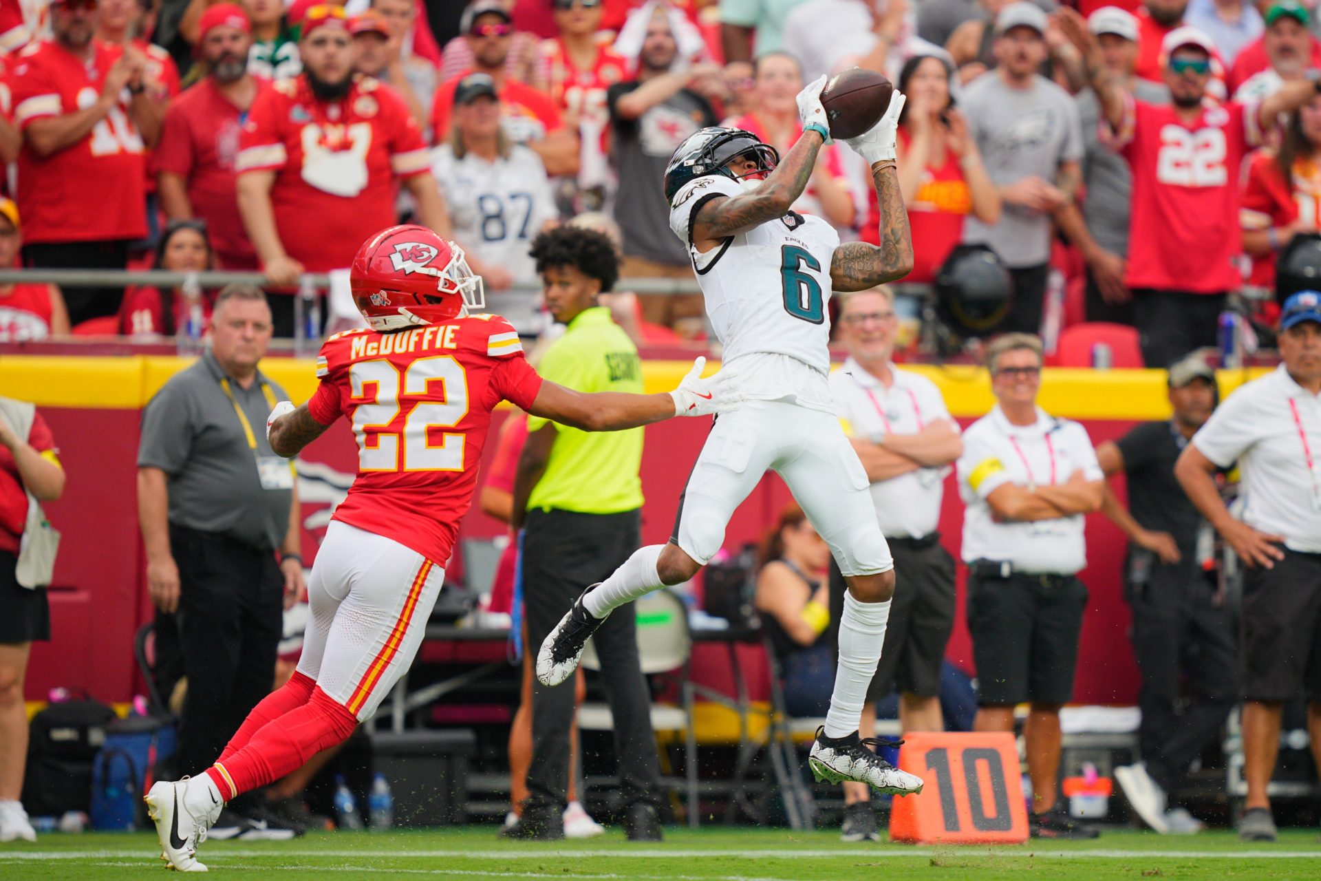 Sep 14, 2025; Kansas City, Missouri, USA; Philadelphia Eagles wide receiver DeVonta Smith (6) makes a reception defended by Kansas City Chiefs cornerback Trent McDuffie (22) during the fourth quarter of the game at GEHA Field at Arrowhead Stadium.