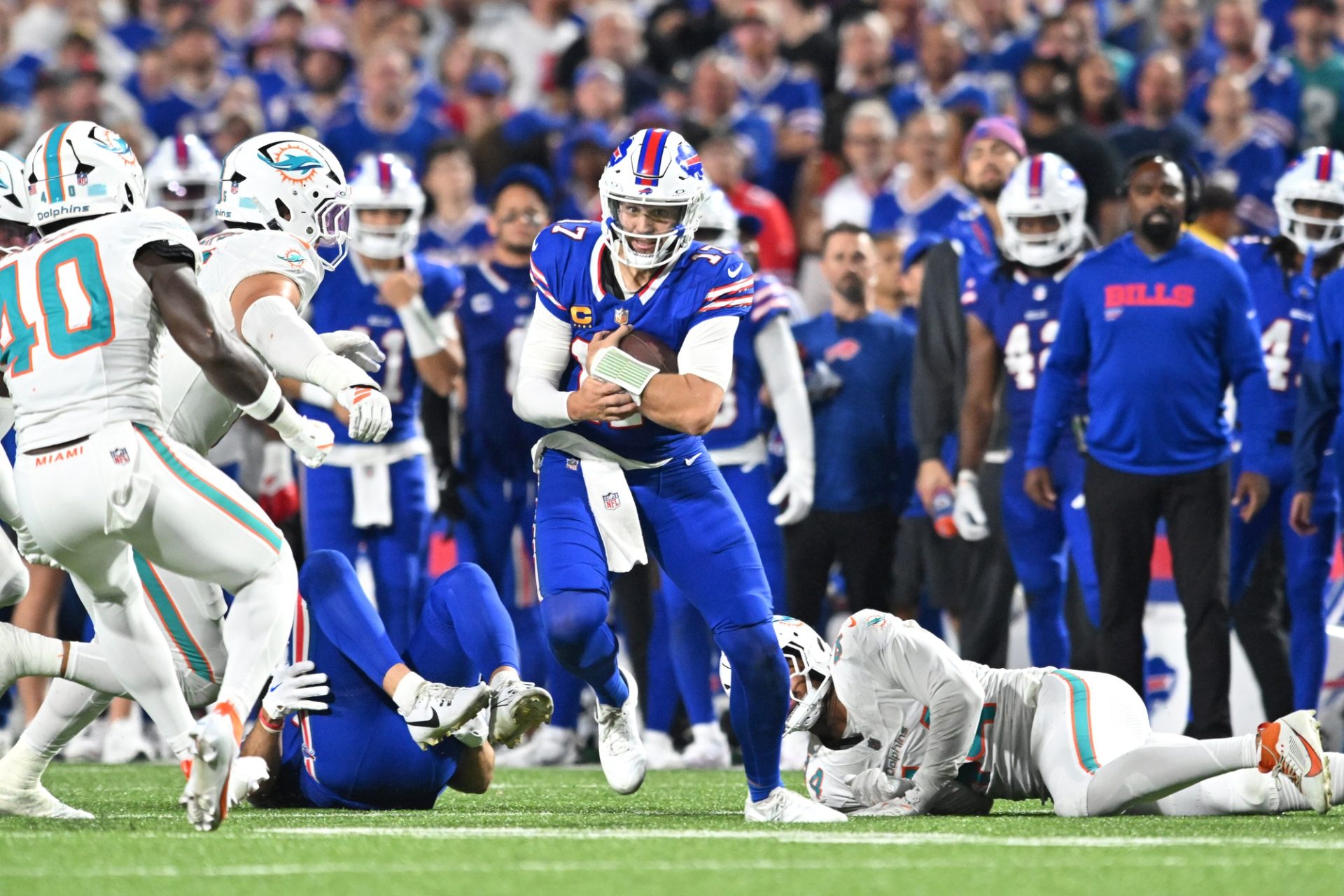 Sep 18, 2025; Orchard Park, New York, USA; Buffalo Bills quarterback Josh Allen (17) runs the ball against the Miami Dolphins in the second half at Highmark Stadium.