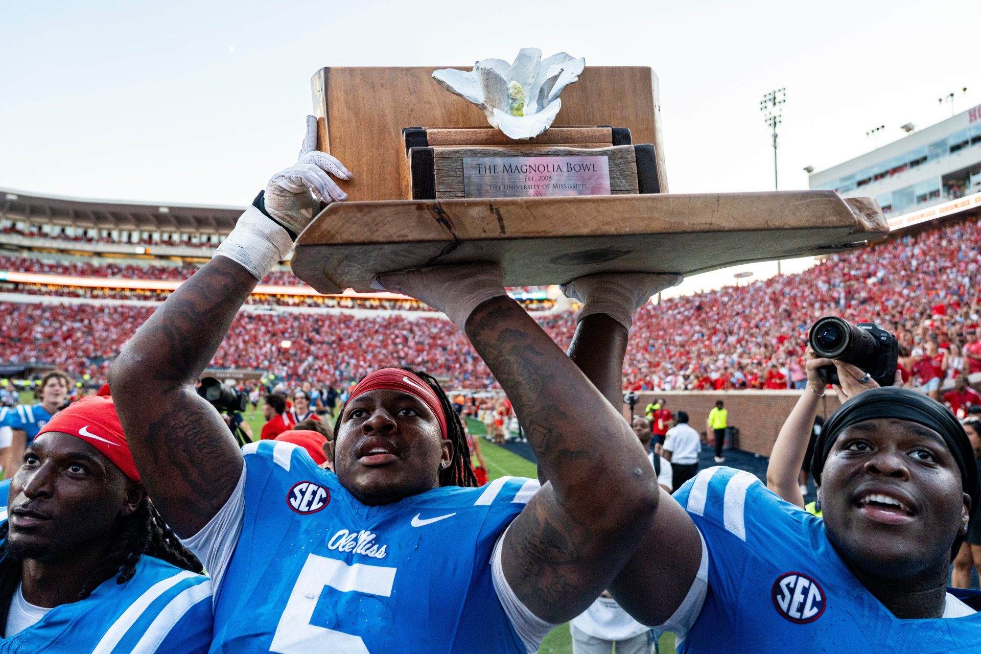 Ole Miss defensive end Kam Franklin (5) and defensive lineman Will Echoles (52) hold up the Magnolia Bowl trophy after a college football game between Ole Miss and LSU at Vaught-Hemingway Stadium in Oxford, Miss., on Saturday, Sept. 27, 2025. Ole Miss defeated LSU 24-19.