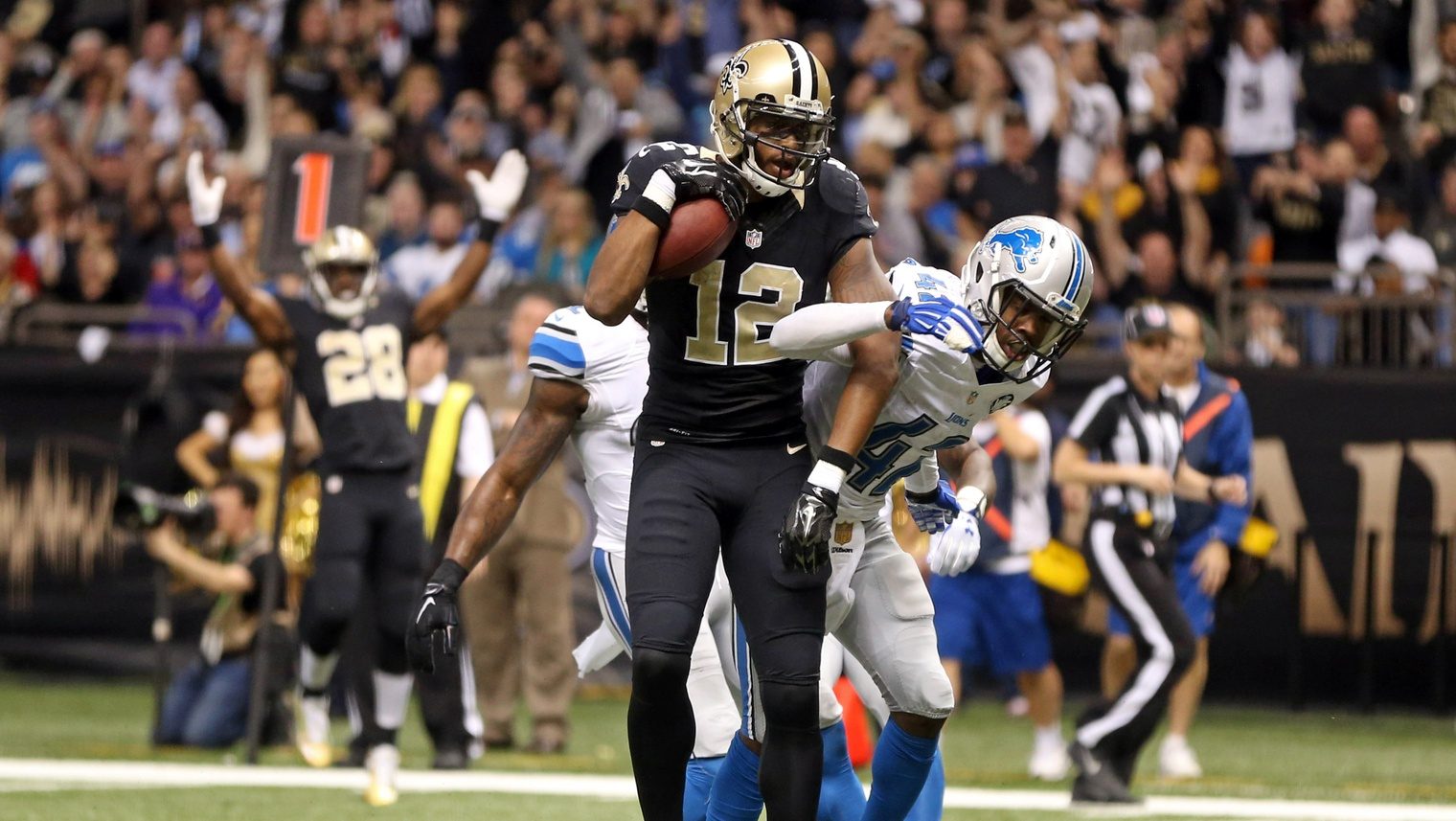 Dec 21, 2015; New Orleans, LA, USA; New Orleans Saints wide receiver Marques Colston (12) makes a 12-yard touchdown catch in front of Detroit Lions defensive back Dwight Bentley (41) in the fourth quarter of the game at the Mercedes-Benz Superdome.