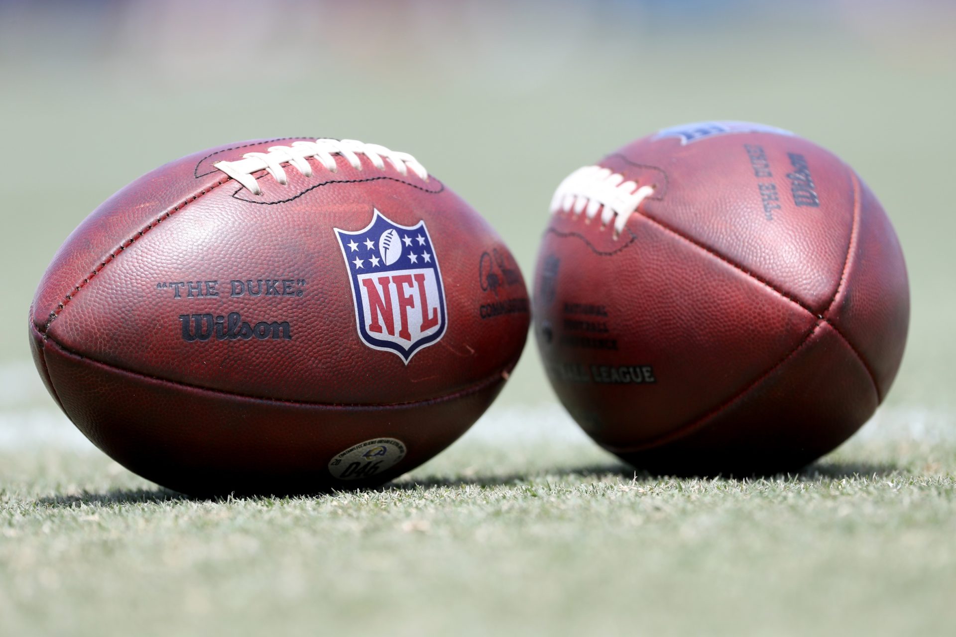 Jul 30, 2022; Irvine, CA, USA; A general view of the official NFL balls on the field during Los Angeles Rams training camp at University of California Irvine.